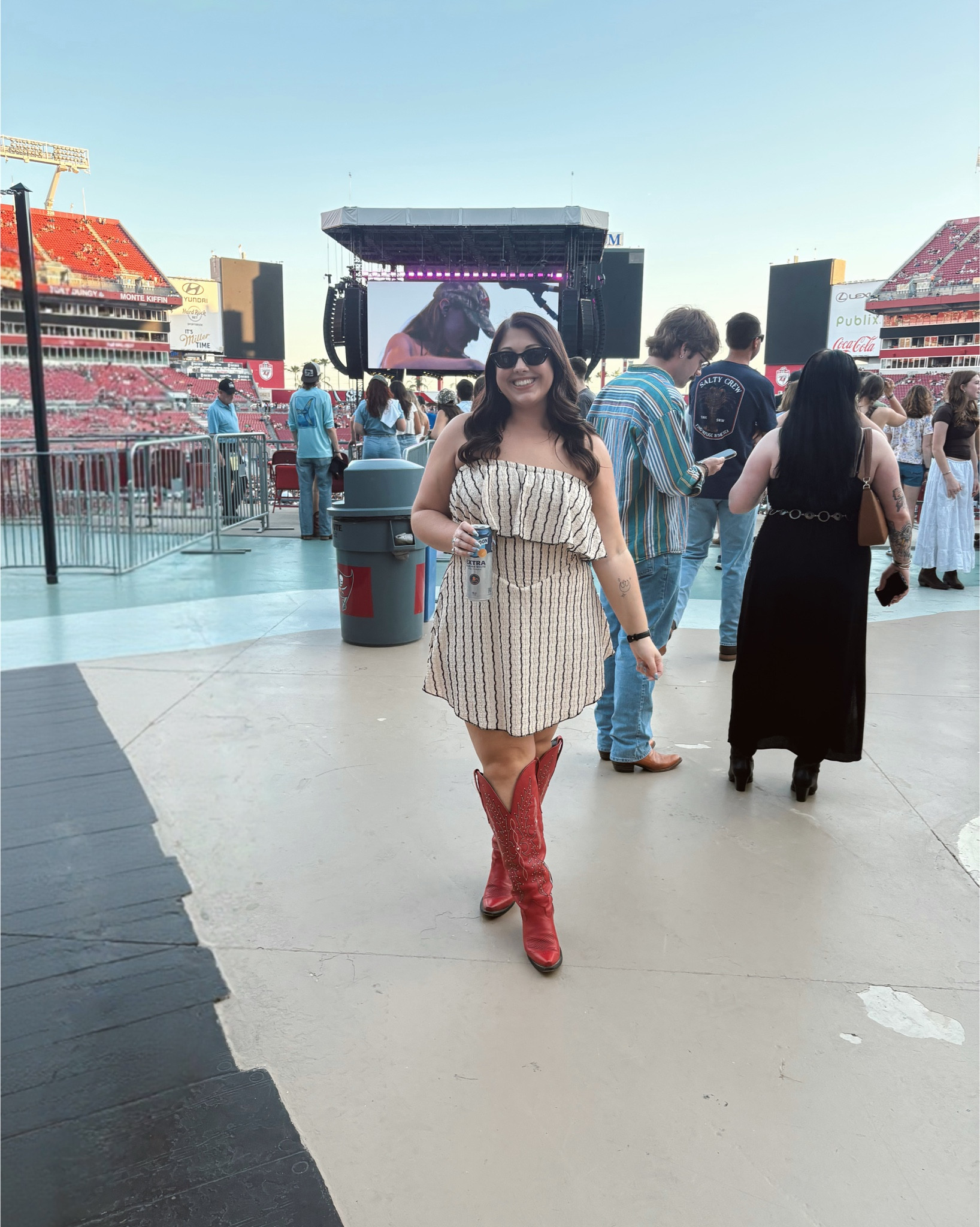 This strapless mini dress is the perfect concert outfit 🤠✨ It has built-in shorts underneath which makes it so comfortable and easy to wear all day (and dance all night). Lightweight, flattering, and perfect for country concerts, summer nights, or weekend plans. Paired it with my red cowboy boots to complete the look ❤️ 

#LTKMidsize #LTKFestival #LTKootd
