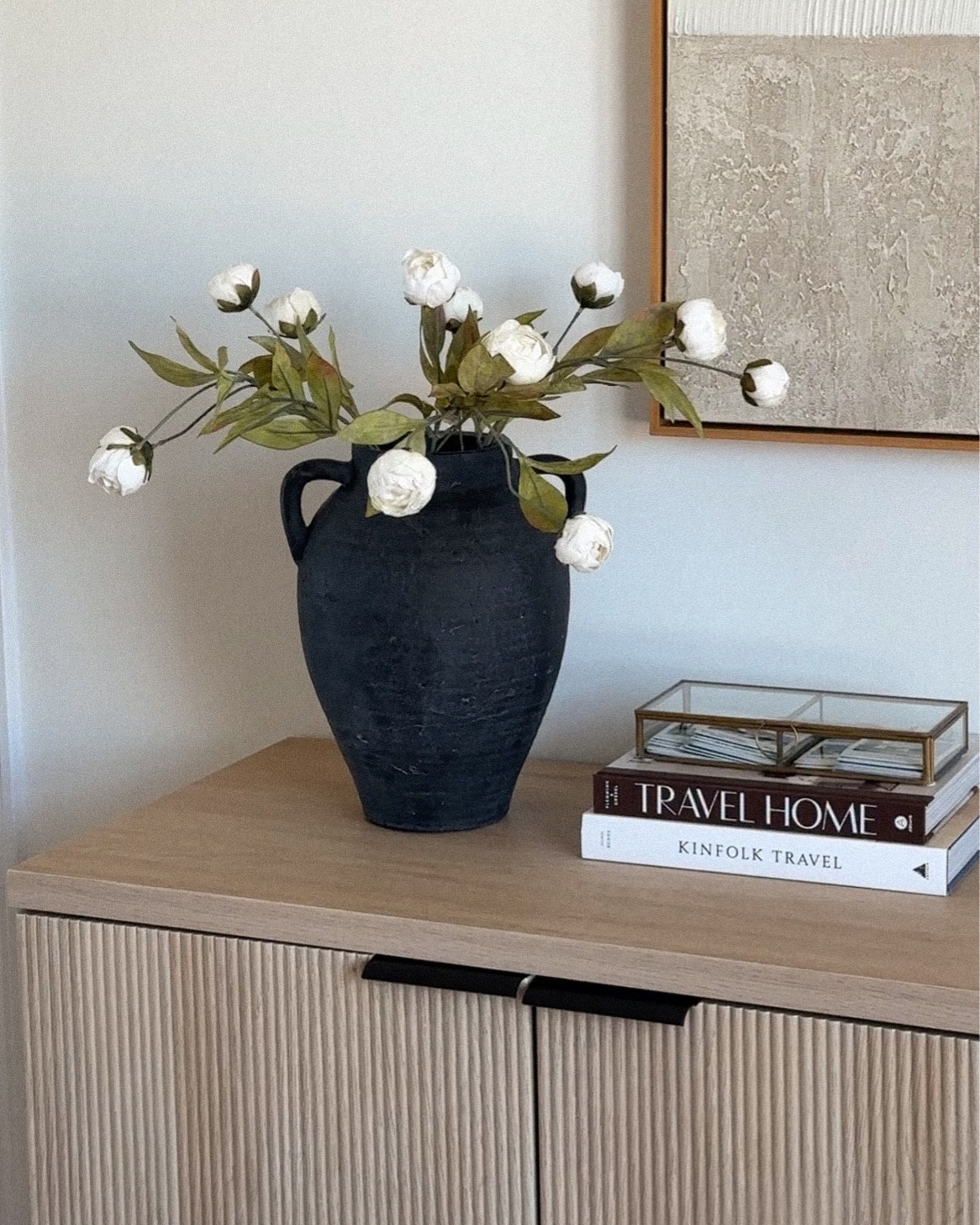 Spring stems. White peonies. Console table. Neutral console table. Oak console table. Decorative books. 

#LTKfindsunder50 #LTKhome #LTKstyletip
