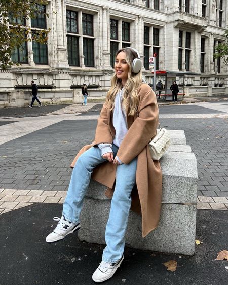 Combining activewear with smarter pieces is a personal fave for running errands in winter. I've paired a grey hoodie & my airpods max with a belted brown coat, wide leg jeans, new balance 550s and my chanel small classic flap in white.

#LTKSeasonal #LTKstyletip #LTKeurope