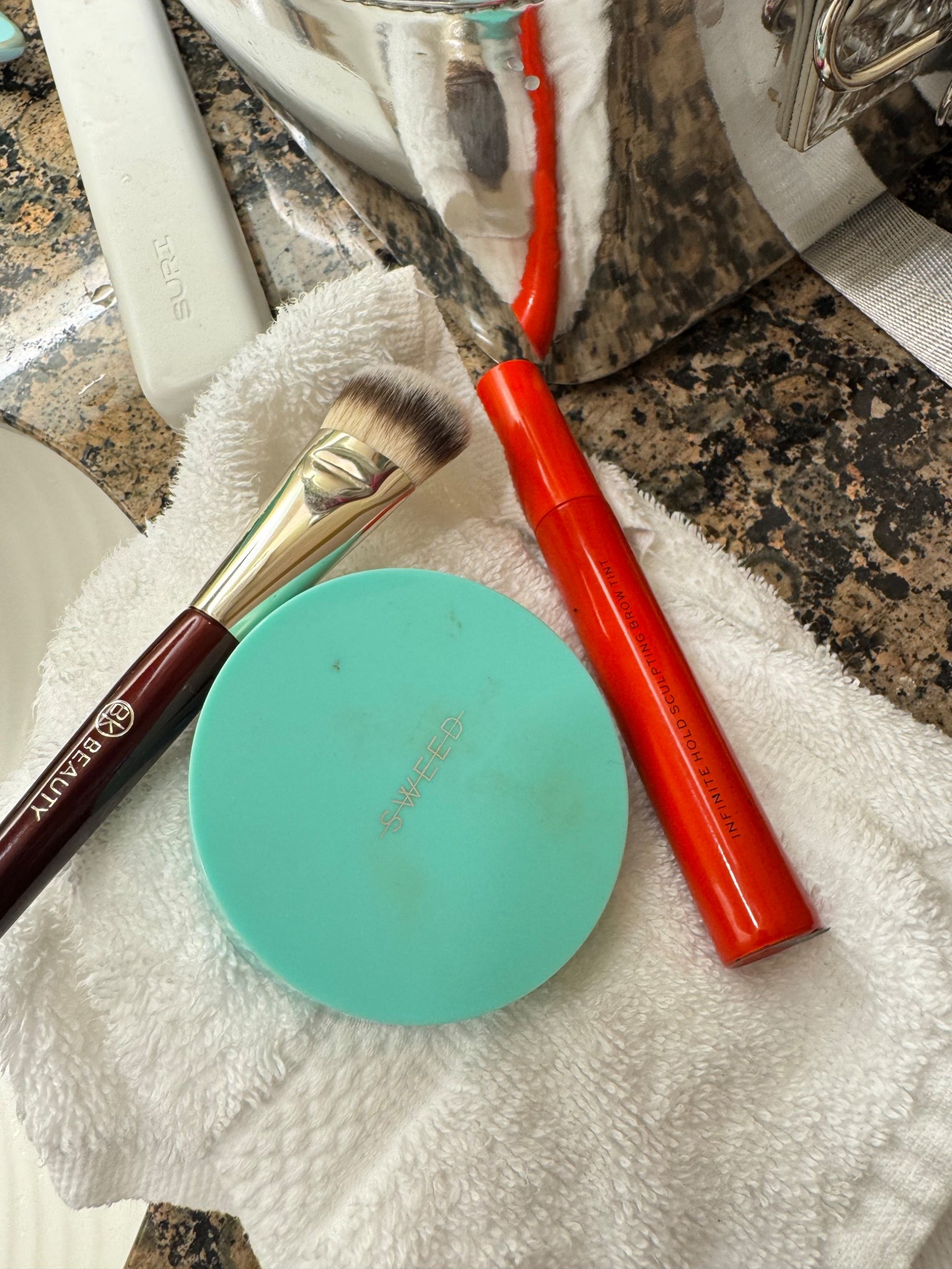 Musts. 
Bronzer is medium golden and brow gel is cool taupe  