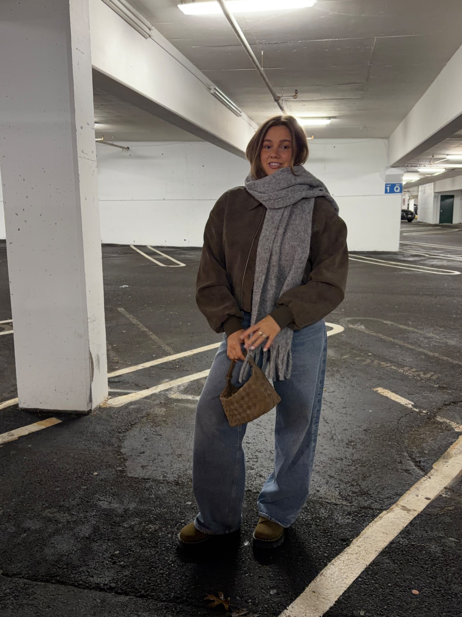 Scarf is amazing quality will last for years and so warm. Linked similar jacket this is last years style. Jeans low rise soft rigid denim true to size for this baggy fit! Amazon purse is woven and looks super expensive. Dr marten slides are platforms, comfy, true to size and perfect for all weather I love the green color it’s subtle and they go with everything! 

