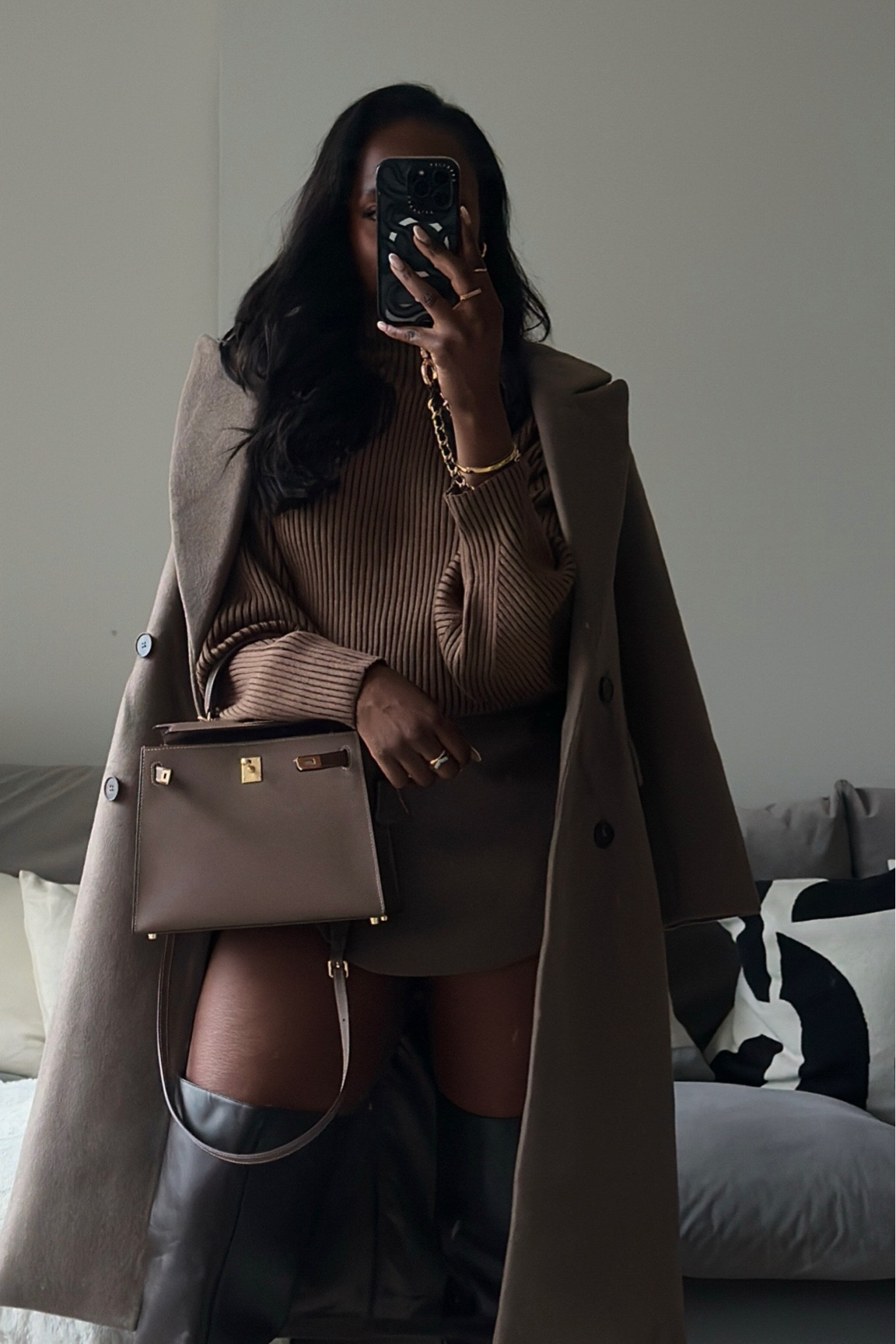 All brown outfit, monochrome outfit, winter outfit, brown tones, neutrals, varley knit top, brown skort, knee heigh boots, black boots, casetify phone case and strap, forever new brown coat 

#LTKstyletip #LTKeurope #LTKSeasonal