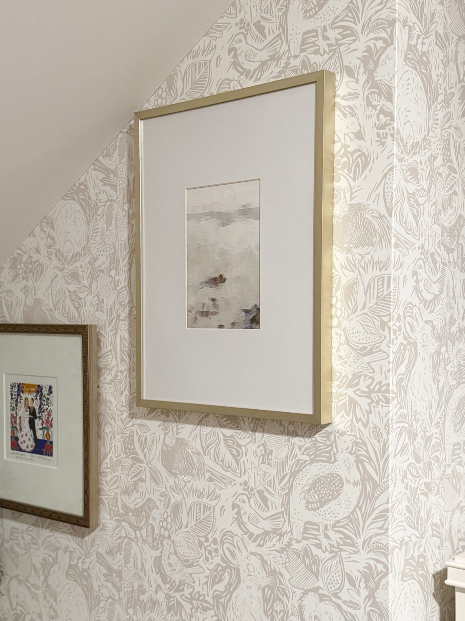 Tackling a few mini projects each day: this morning it was hanging some art in our attic (which doubles as a second guest bedroom and my casual office!!) This peel-and-stick wallpaper was bought and installed on a whim but I still love it!

#LTKHome #LTKdayinmylife #LTKstorytime