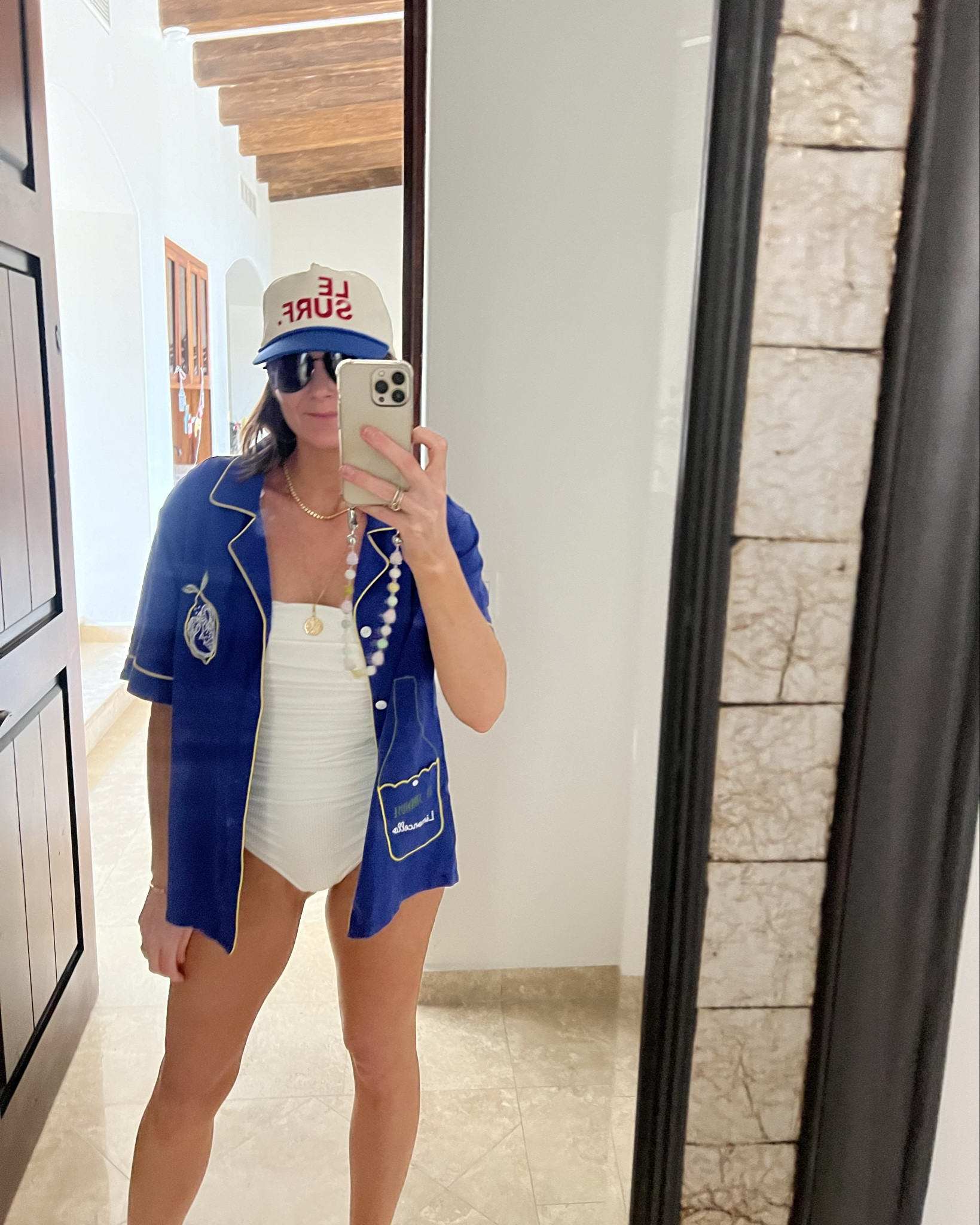 So obsessed with this suit. The ruching is SO flattering and it disguises nippin out.  And the suit itself is not sheer when wet  — blue top is tombolo 'Le Sirenuse' Limoncello shirt (sold out )

#LTKover40 #LTKmidsize #LTKswim