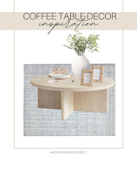 Coastal coffee table decor inspiration! This includes this wooden round coffee table, coffee table book, white ceramic vase, faux stems, rattan picture frames, pottery dish, wooden chain link, and area rug. 

coastal decor, coastal home, coastal style, pottery barn, pottery barn home, coffee table, furniture, amazon, amazon decor, amazon home, coffee table decor, vase, target, target decor, serena and lily, area rug, blue area rug, beach house decor 

#LTKhome #LTKstyletip #LTKFind