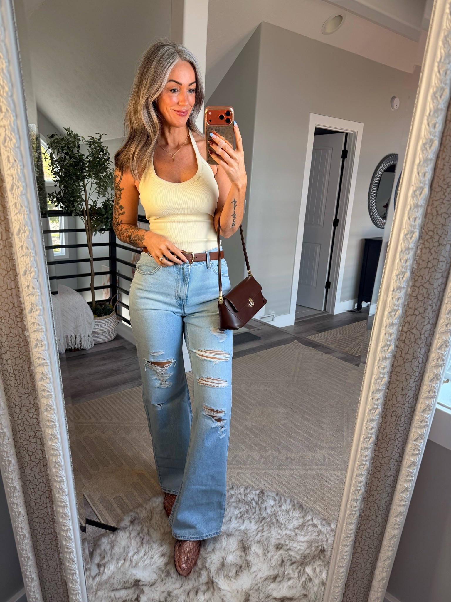 Loved this halter tank with built in bra when my chest was larger and still love it now post surgery! Wearing size small. Jeans are Levis loose boot

#LTKOver40