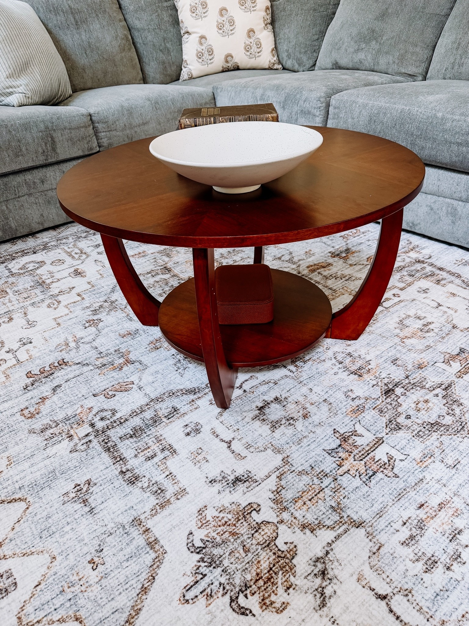 Walnut coffee table
Blue and tan oriental rug

#LTKHome