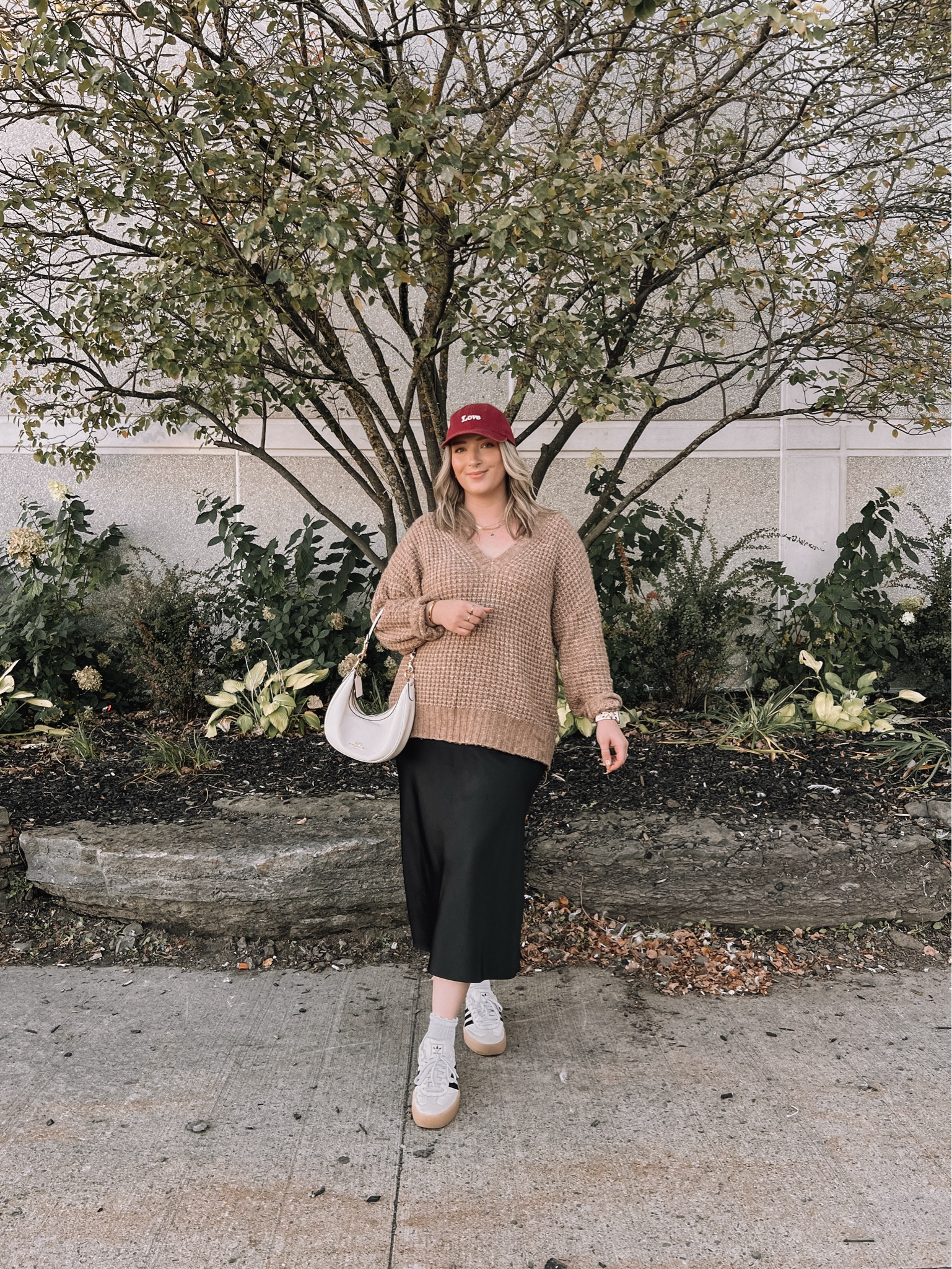 Midsize fall outfit - black satin midi skirt 50% off (TTS - L), neutral sweater (linked similar), red baseball cap, Coach shoulder bag, adidas Sambae sneakers (so comfy but run big - I’m usually a 9.5-10 and wear a 9)


#LTKmidsize #LTKautumn #LTKcanada