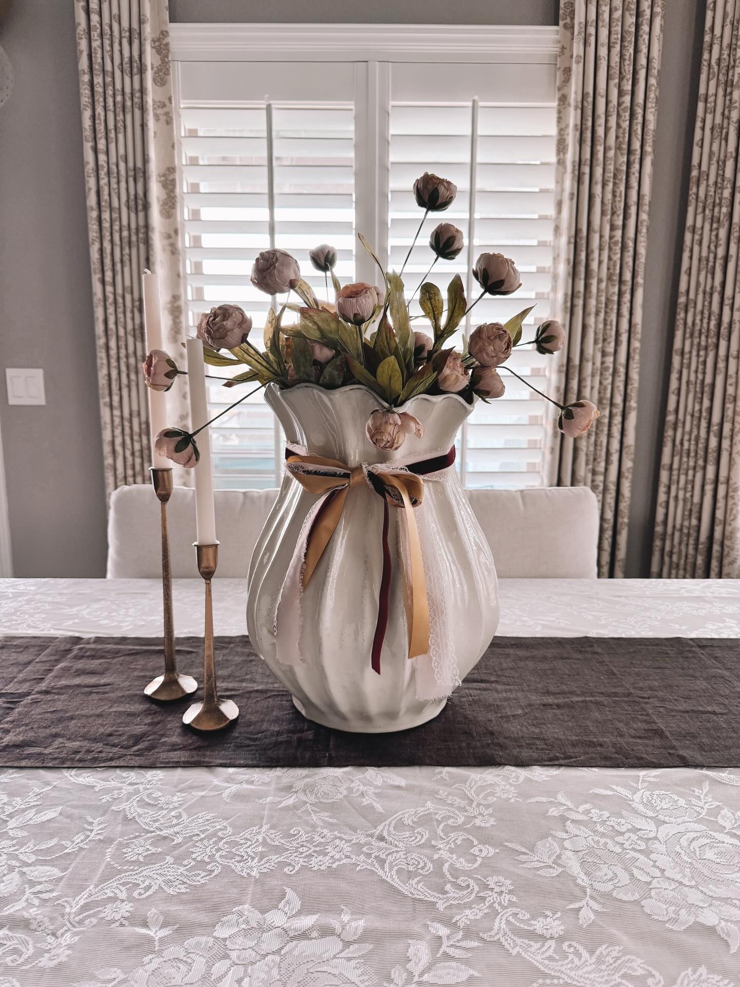 You taught me how to blow bubbles with my bubble gum. 
You taught me how to make breakfast.
You taught me how to drive.
You taught me to “test”the candy at the grocery store before filling my bag. 
You taught me the importance of taking care of my feet. 
You taught me how to do yard work.
You taught me to always be kind but take sh*t from no one. 
You taught me to never lie, it only gets you in more trouble. 

I miss your jokes and your humor. You were so fun and so funny. 
I miss your smile, I can still hear your laugh. 
I miss going to the movies and eating ice cream with you.  I miss being a little kid because of you. 

You showed me what unconditional love is and I never had to question your love for me. You showed me kindness and what family really is and what it meant to you. 

You were my favorite person. Rest easy, Papa. 
I know you’re in a much happier place now. 

It’s been a difficult start to 2026 with medical issues and the loss of my grandpa. I’m hoping things start looking up from here on out. 

I went for a simple look in the dining room with Valentine’s Day in mind because when you’re here, I want things to be simple, easy, peaceful and beautiful. I am still crushing over my gorgeous curtains from @unicurt_curtain_ 

#diningarea #valentinesdecor #neutraldecor #customcurtains