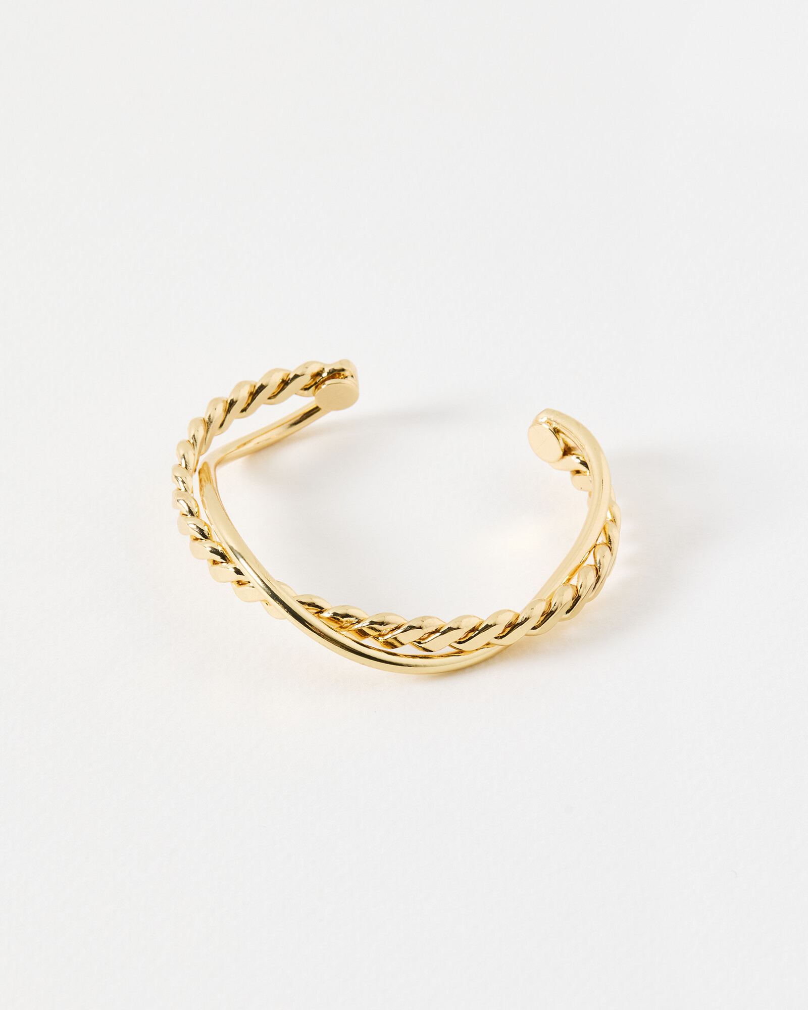 Jessie Twisted Cross Over Gold Tone Bangle | Oliver Bonas | Oliver Bonas (Global)