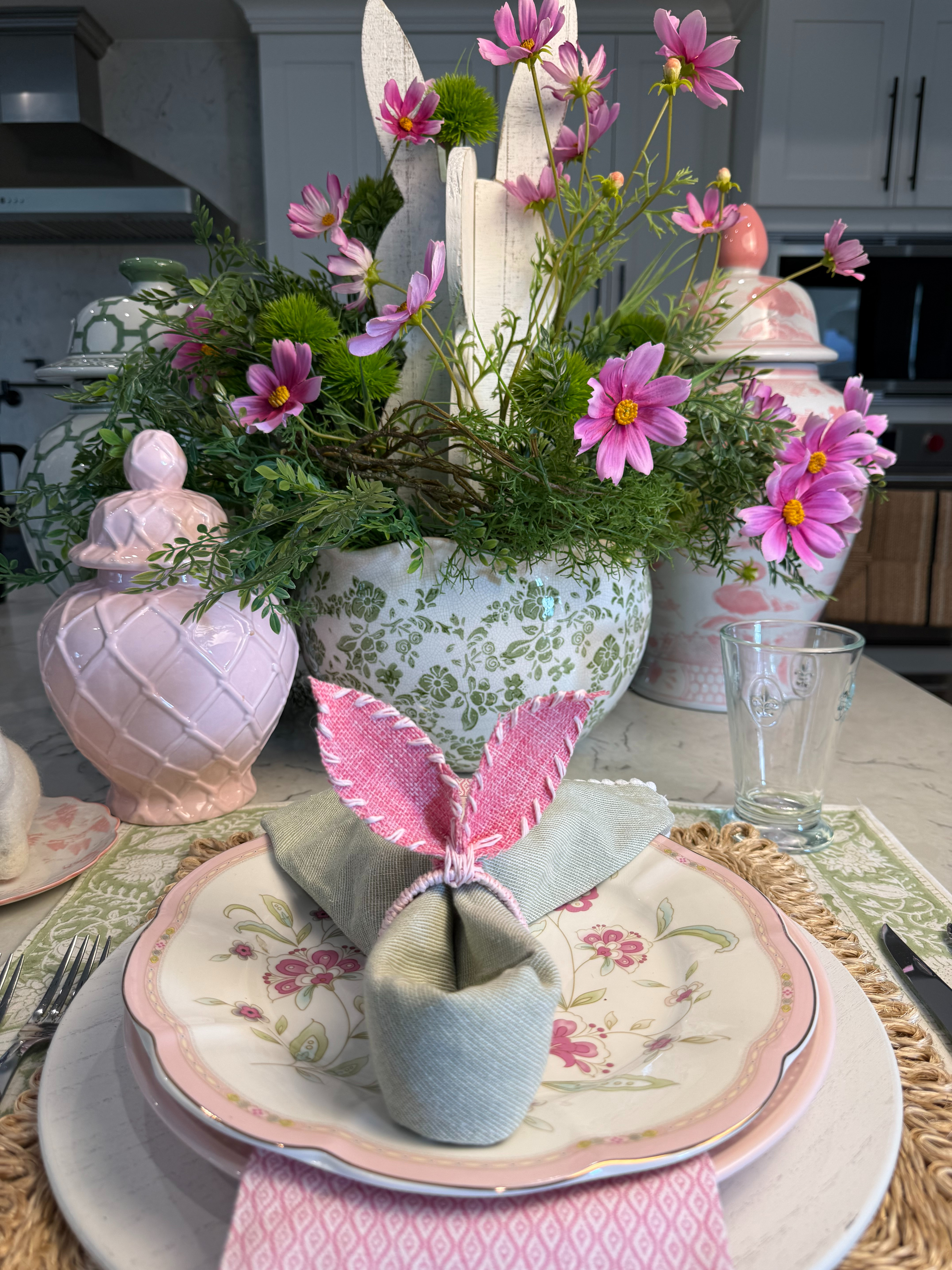 Easter Tablescape

Faux flowers with Easter bunny napkin fold. A perfect tablescape for a spring special occasion. 

, 

 #ltkspring #ltktable #LTKSeasonal #LTKHome