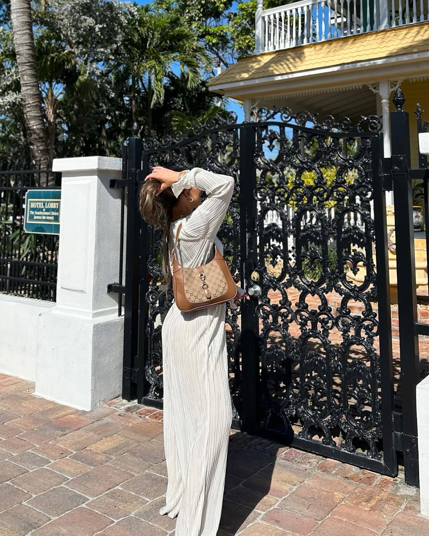 If you’re going on vacation or if you’re a bride to be, this set is perfection! Swipe to see how pretty looks when the sun hits. This oyster color is under $90 and it comes in green, brown, and black. The shoulder bag is giving high end vibes but only $20. Of course, wearing my favorite layering gold necklaces to compliment my outfit - code IRIS10 saves you money. 

Comment “shop” to receive all the details. 

#vacationstyle #vacationfashion #resortwear #resortstyle #bridetobeoutfit #whiteset #pleatedset #casualstyle #monochromaticoutfit 
White outfit, wide leg pants, crop top, long sleeves, gold jewelry, neutral look, beige sandals, designer inspired, chic style, Celine sunglasses dupes, vacation must have

#LTKtravel #LTKwedding #LTKitbag