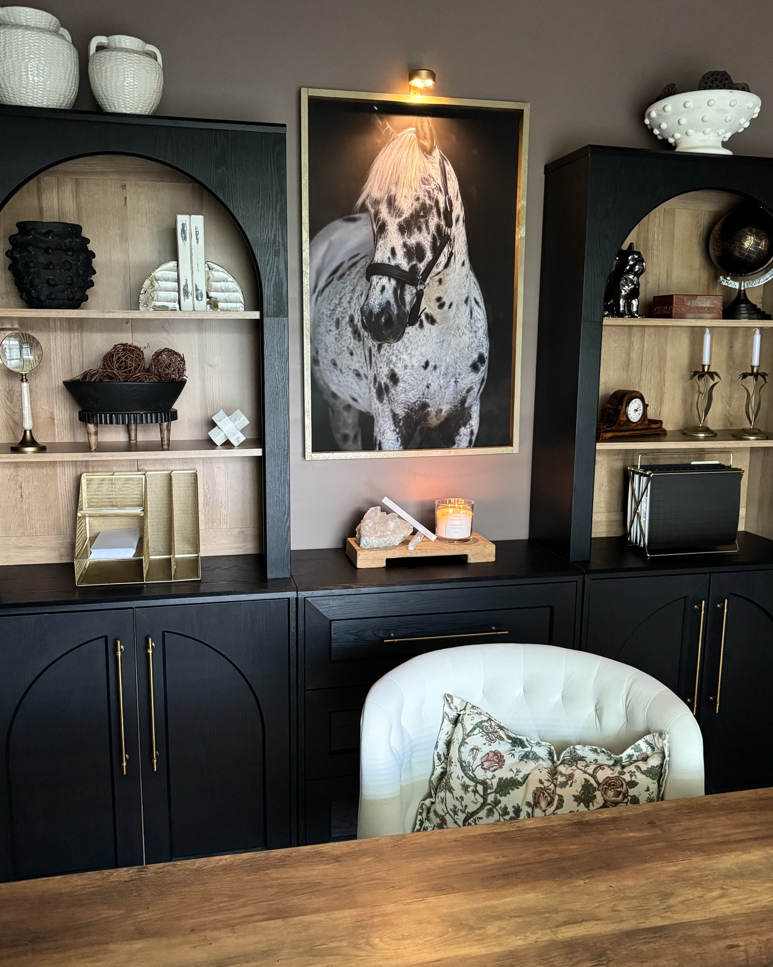 Moody study!!🤎 The new magnetic picture light has totally elevated my beautiful horse print.

These are rechargeable, magnetic, 3 color temps and are dimmable. 

Magnetic picture lights, office furniture, Mopio Blake cabinets, desk, velvet task chair, gold organizer, candle pedestal, cream vases

#LTKstorytime #LTKSeasonal #LTKHome