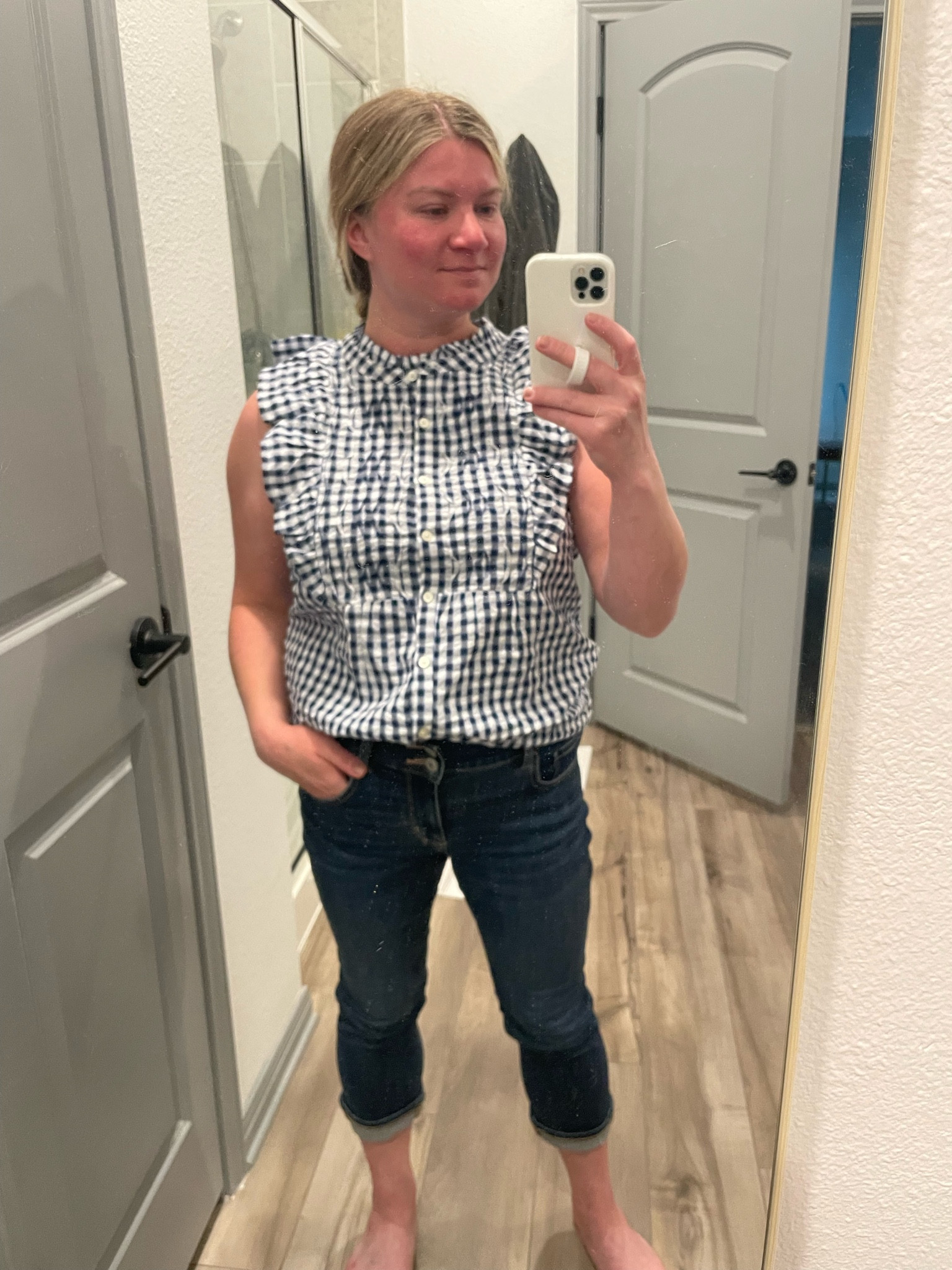 Loft gingham ruffle sleeveless blouse and American eagle jeans

#LTKstyletip #LTKunder100 #LTKFind