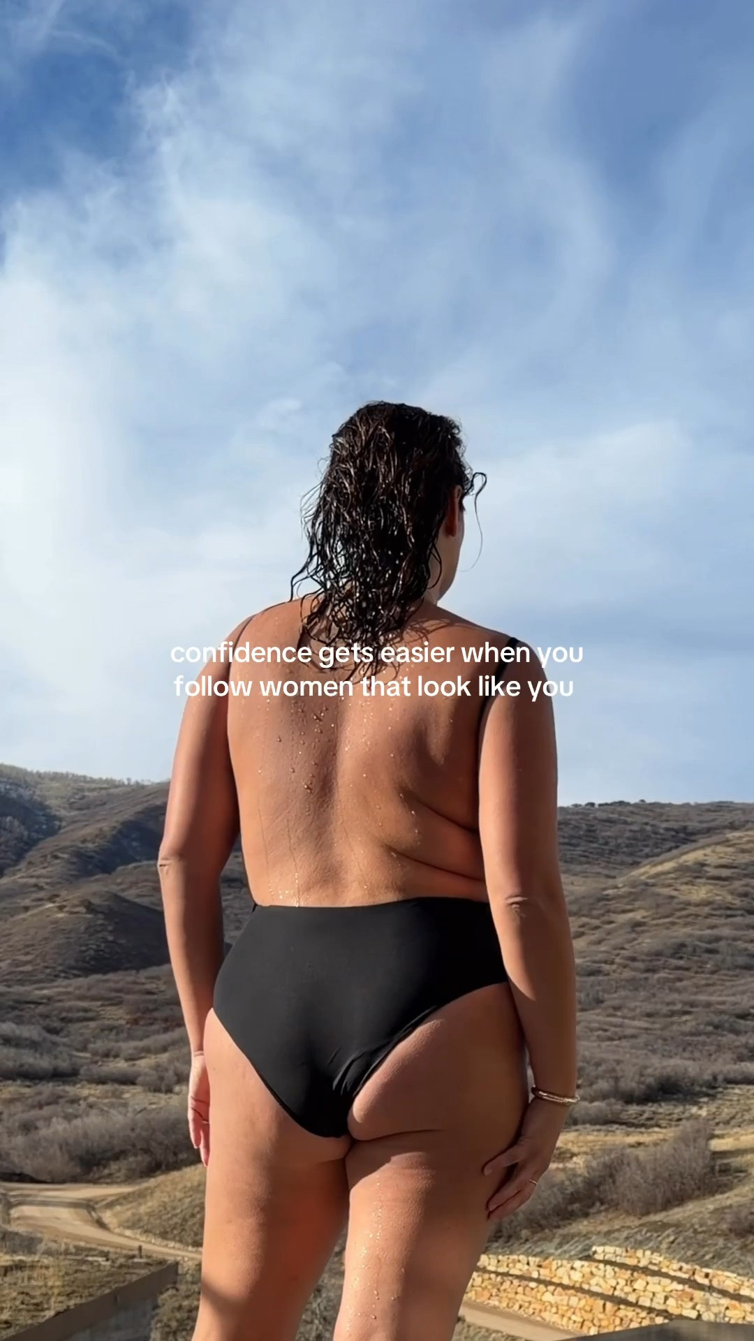 love the shape of this open back swimsuit 