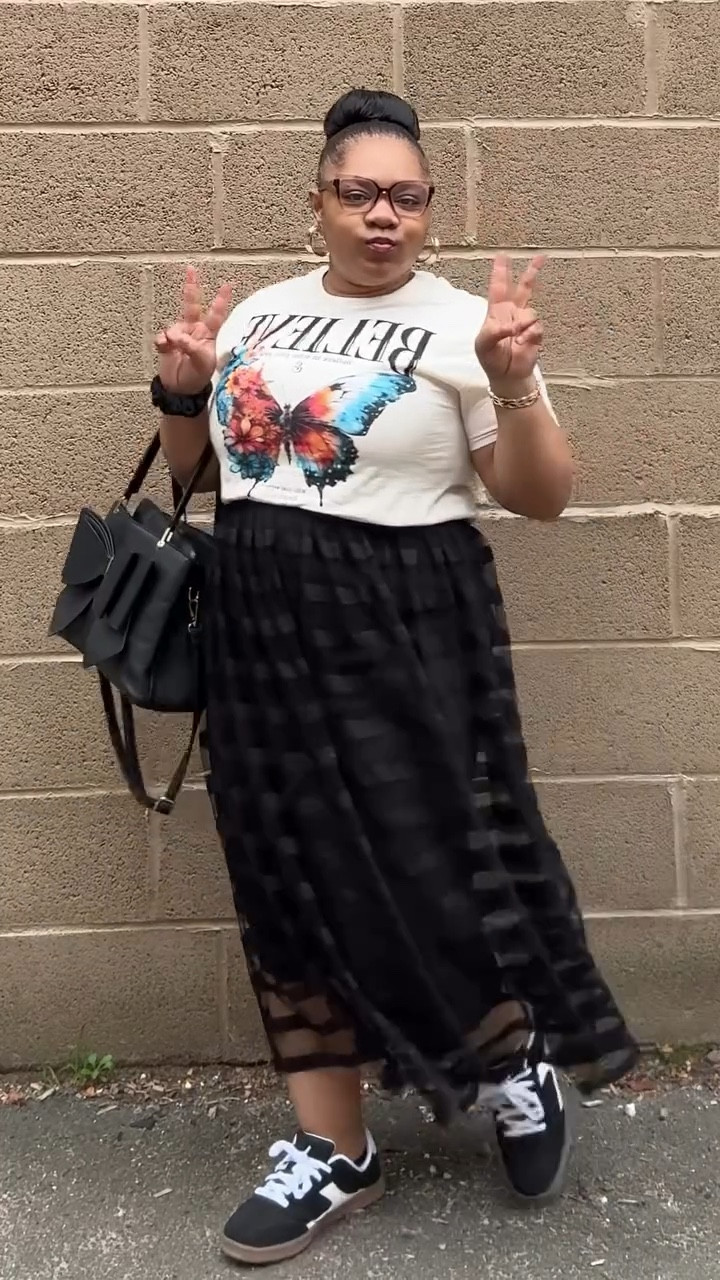 Office fit, but make it affirming. 🖤

Pulled up to purpose in a “Believe in Who You Are” tee and a sheer skirt that says, “I know exactly what I bring to the table.”✨ Burgundy lip, gold drip, and sneakers because I’m still that girl even when I’m keeping it casual.

Don’t second guess the power in your presence—believe in her. 💋

Fit deets below 👇🏽 

👚 Shirt – @walmart 
👗 Skirt – @burlingtondeals 
👟 Sneakers – @walmart 
🎀 Purse – @burlingtondeals / @rainbowshops 
💄 Lip – @tonikpromua 
✨ Accessories – @adornherjewelry.co 
🤓 Glasses - @zeelool 

Double tap if you’re walking into rooms like you own ’em. Tag a sis who needs to stop second guessing her glow. 💅🏽

⸻

#ItsALovelyDay #OOTDReel #AffirmationStyle #ChicBossEnergy #FaithAndFashion #StyleOnPurpose #SheBelieves #ChristianInfluencer #ModestBaddie #SoftBossEra #BelieveInHer #SassyAndSaved 
#zeeloolcircle
#pride2025