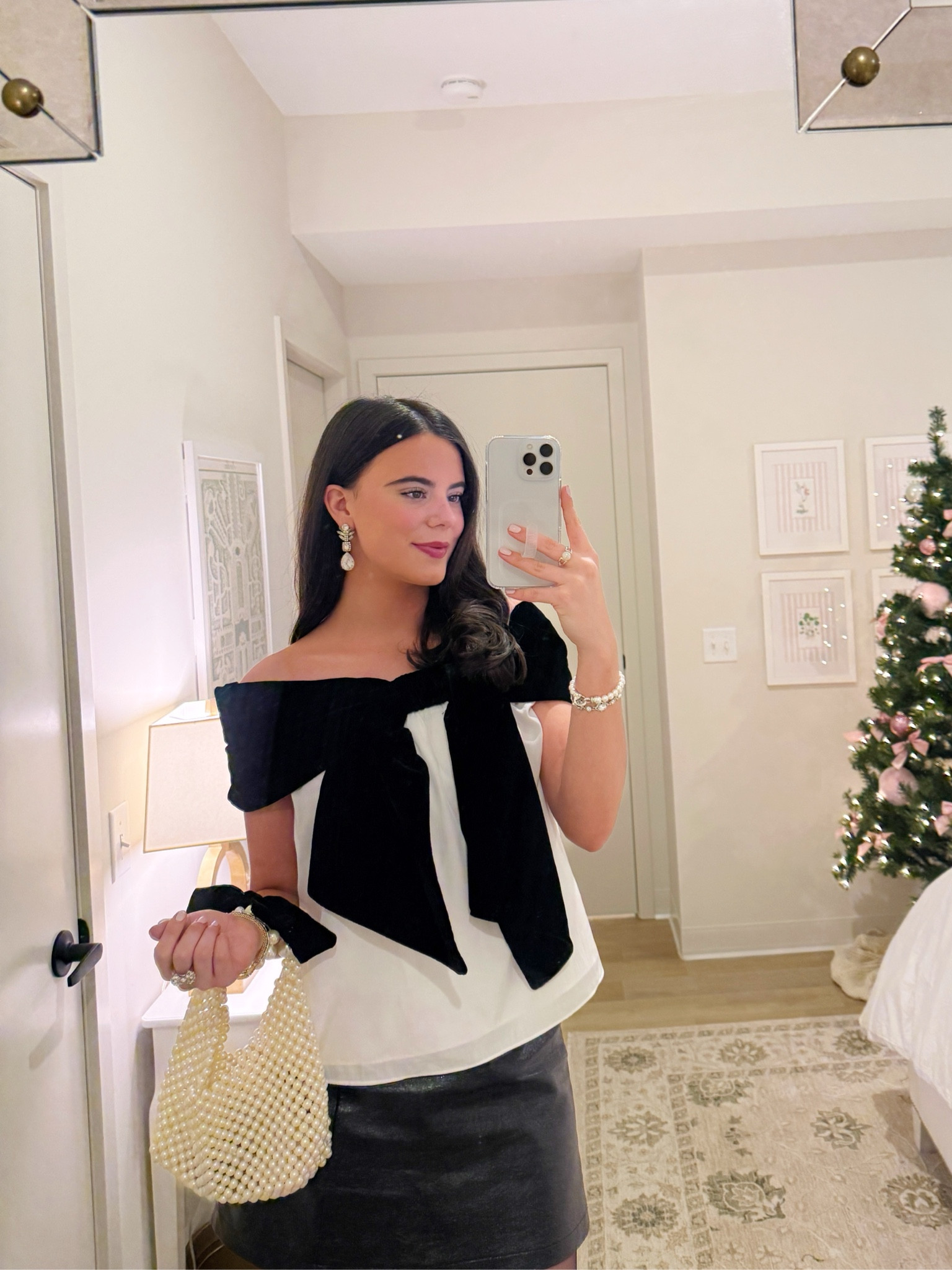 Outfit of the night for a holiday party!🎀 Top is new from Anthropologie, bag is Target and still available! I paired the look with a little leather skirt, sheer tights and a black heel!✨

#LTKGiftGuide #LTKSeasonal #LTKHoliday