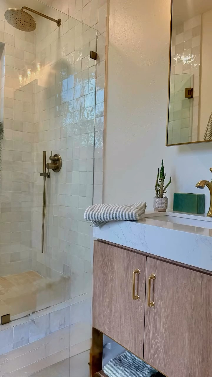 Bathroom Remodel REVEAL! Check Out Our Dreamy New Bathroom.🛁✨

It’s finally here! After months of planning, demo, and design, our bathroom remodel is complete, and I’m beyond thrilled to share every detail with you! This transformation has been a labor of love, and I absolutely love the results.🤍 

Check out my LTK (link in bio) for the links to the products I used!

➡️ Before & After: The ultimate glow-up!
➡️ Demo Day: Out with the old!
➡️ New Window Frame: Hello, natural light! 
➡️ Hot Mop: Essential waterproofing.
➡️ Tile Install: Watching the vision come to life.
➡️ Finds: Our stunning new vanity & light fixture.
➡️ Luxurious limestone flooring.
➡️ Zellige Tile: Adding that perfect touch of texture.
➡️ Hardware: Sleek and functional!

Every piece was carefully chosen to create a serene, spa-like oasis right at home. I’m so in love with how it turned out! 😘

“What’s your favorite part of the remodel? Let me know in the comments! 👇 “For all the product links, design tips, and more home decor inspiration, follow @marneys_tidbits on LTK and check out my blog at marneystidbits.com!”

#bathroomremodeling #bathroomremodel #beforeandafter #homedesign

#LTKHome