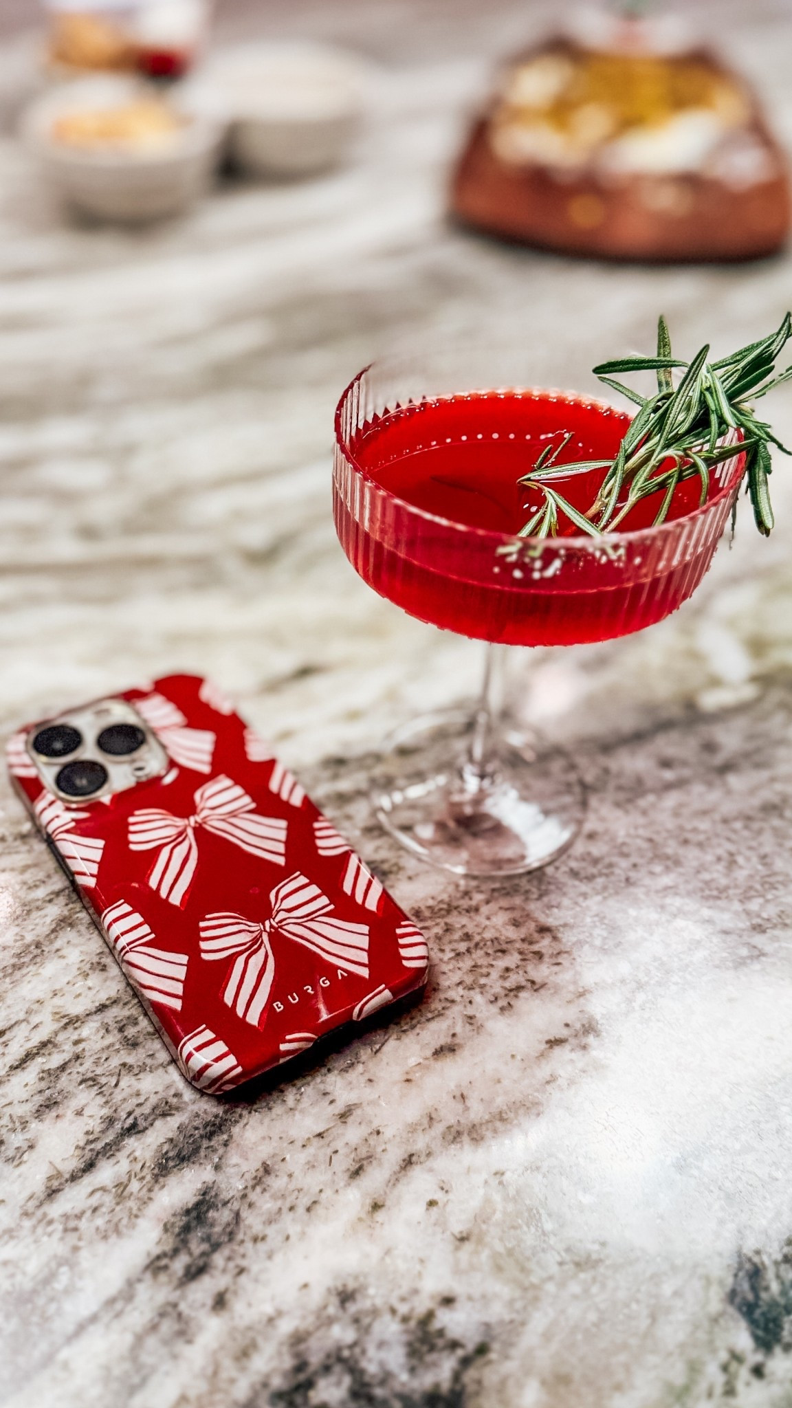 If your holiday drink doesn’t match your phone case… did you even do December right?🎄🍸Linking this adorable coupe cocktail glass (under $9!) &  my Burga red bow phone case because festive details matter.

#LTKHoliday #LTKSeasonal #LTKfoodie