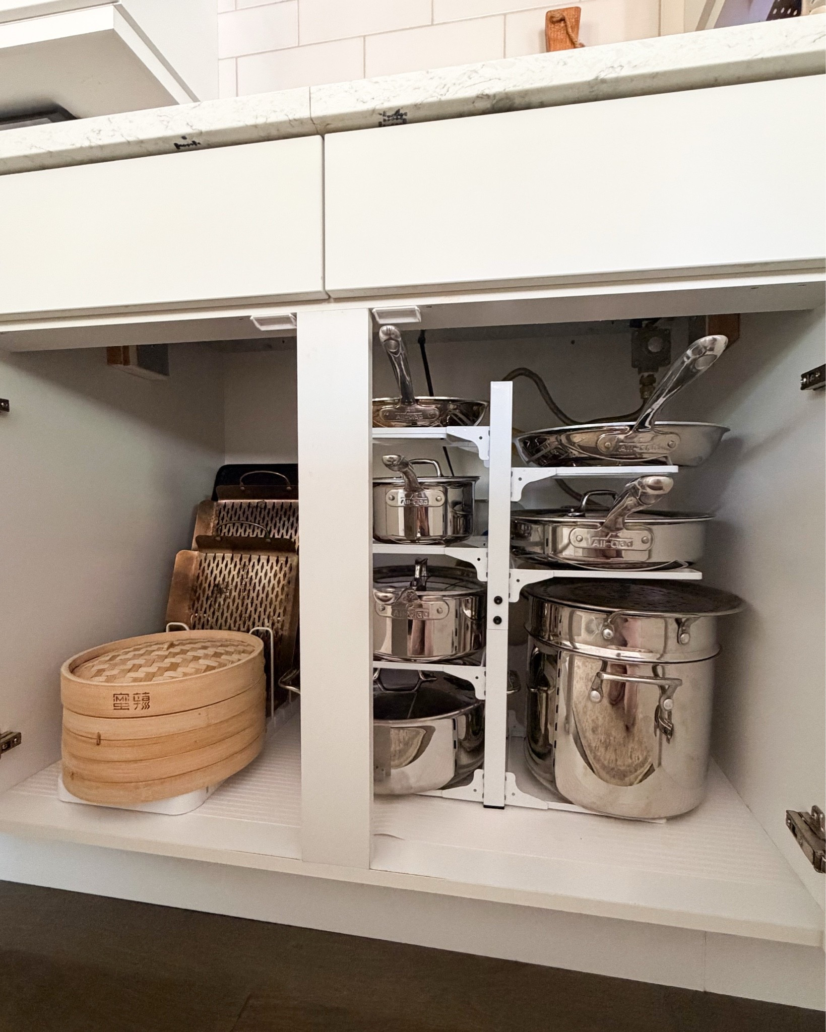 Pots and pans organization under stove! 

Pots and pans organizer, stainless steel cookware set, shelf rack, bamboo steamer basket

#LTKsummer #LTKhome