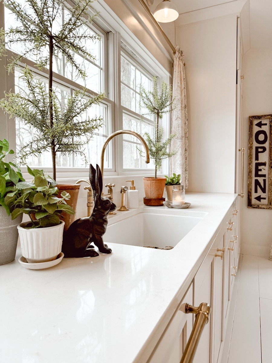 I love the cabinet handles and faucet that we chose in our new-build kitchen. These faux topiaries frame the sink perfectly and have a great ambience for Spring! 

#LTKSeasonal #LTKHome