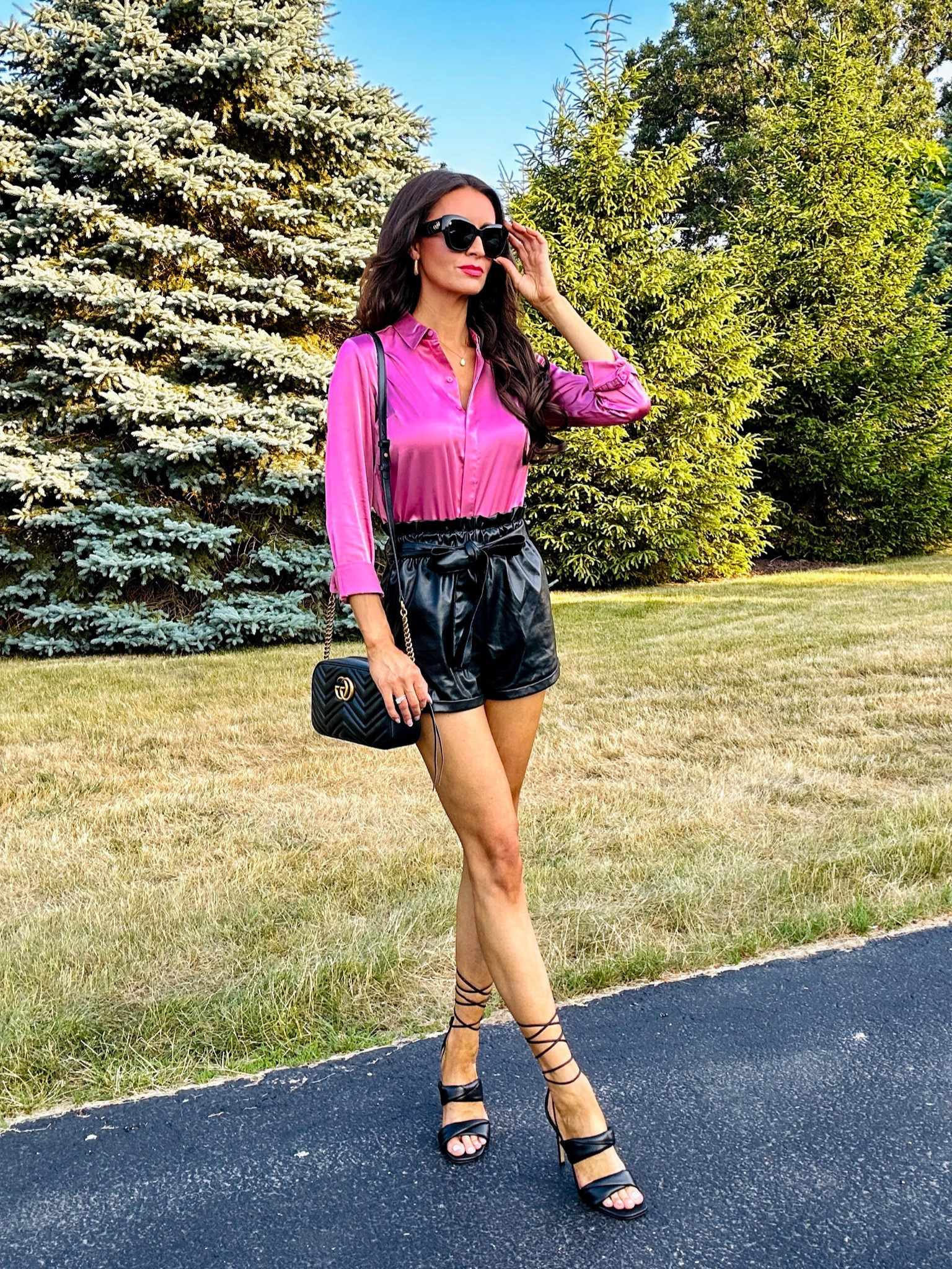 Chic style 🖤 Love these comfy leather shorts and essential satin button down  💗 Paired with my fav date night heels & accessories 🖤💗

#LTKFind #LTKsalealert #LTKU