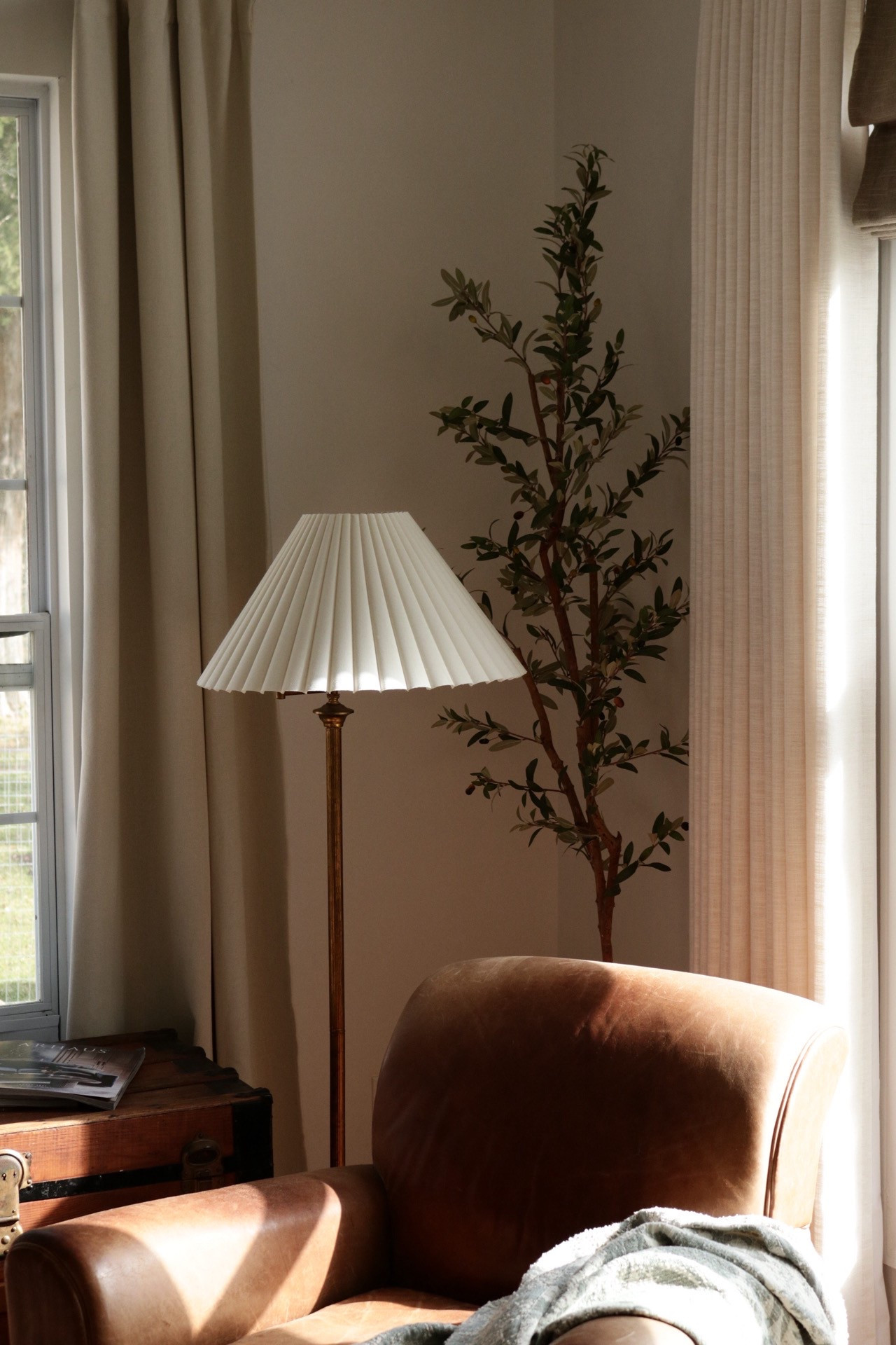 Cozy corner, pleated lampshade, faux tree, olive tree, leather chair, curtains

#LTKHome #LTKStyleTip
