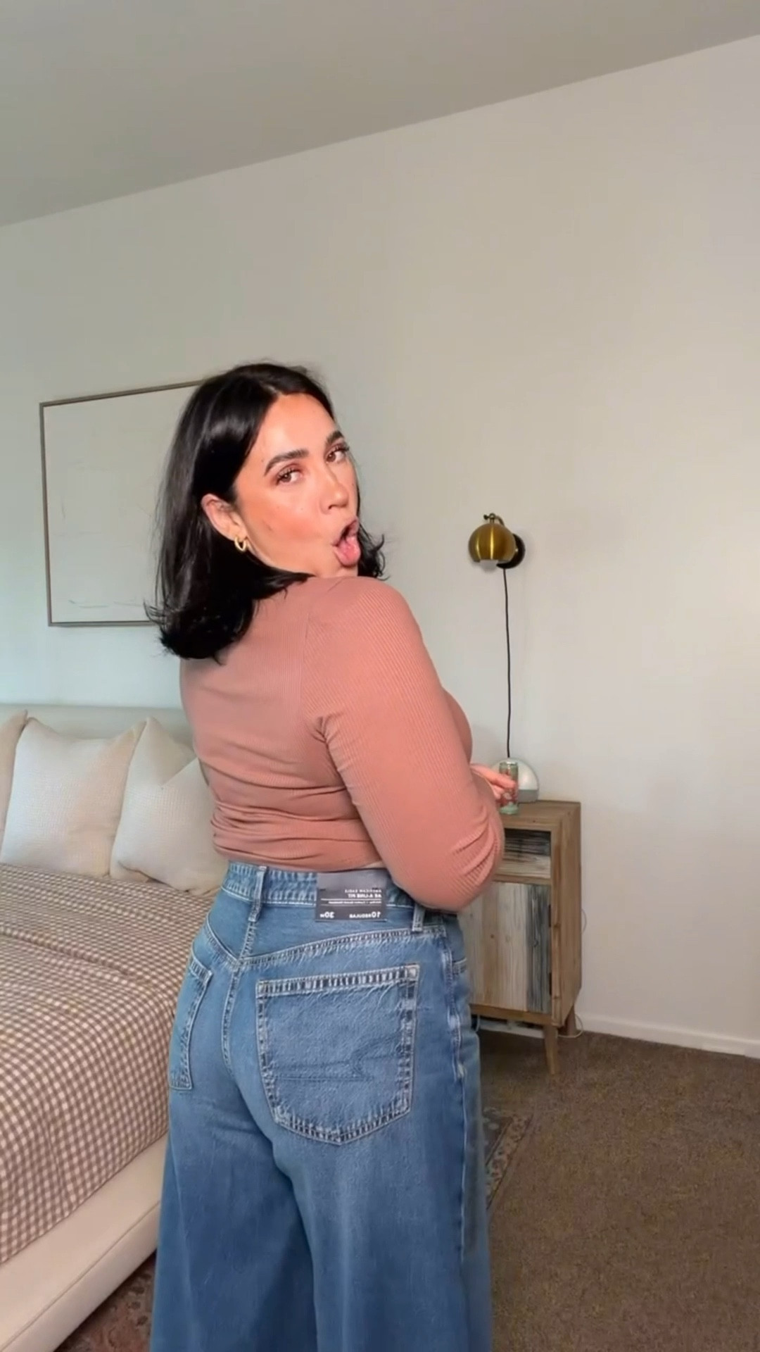 Trying on new America Eagle jeans! These ones are stretchy on the waistband and so flattering for an inverted triangle shape. Super wide leg which gives the illusion of wider hips & longer legs! 

TTS I did a 10 

#LTKMidsize #LTKFindsUnder50 #LTKootd