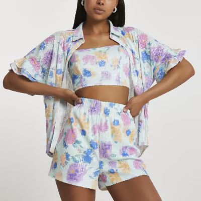 Blue short sleeve floral print shirt£42.00Blue sequin printed bralet£25.00Blue short sleeve flo... | River Island (UK & IE)