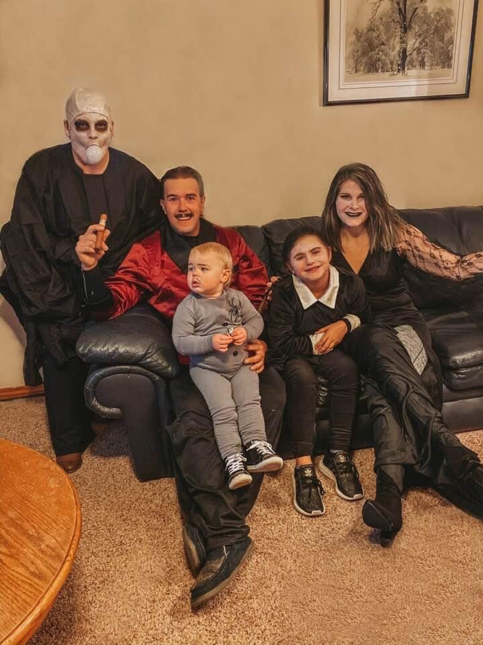 Addams family costume idea!! We DIY baby Addams outfit from a gray winter long sleeve top & pants. & then glued on a spider patch! This was definitely one of the best costumes we have done & loved that we could do it as a family!! 

#LTKHalloween #LTKfamily #LTKHoliday