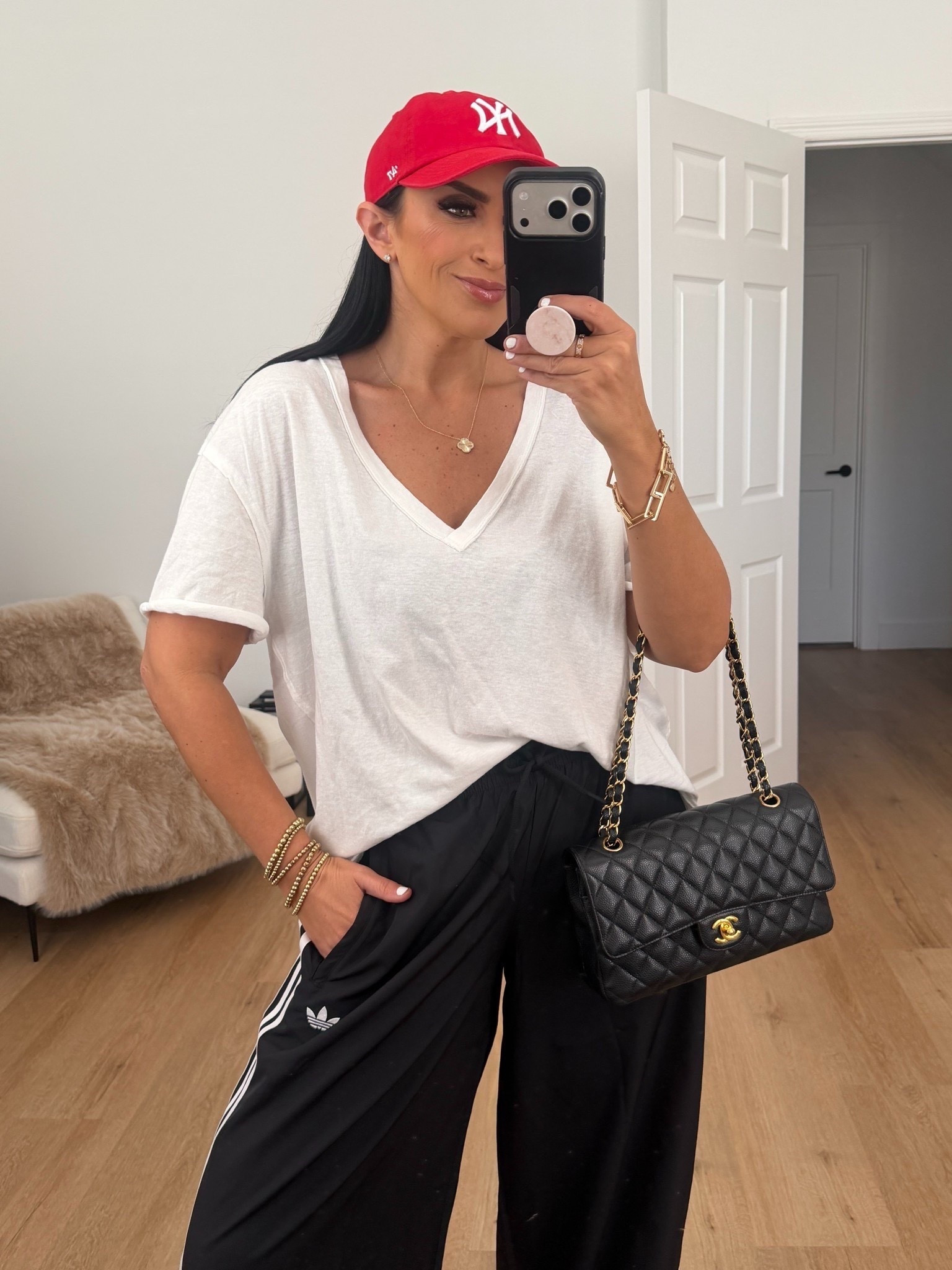 Adidas firebird adilenium track pants in black wearing size small. Free people oversized tee wearing size xs. Cow print sambas run true to size 
