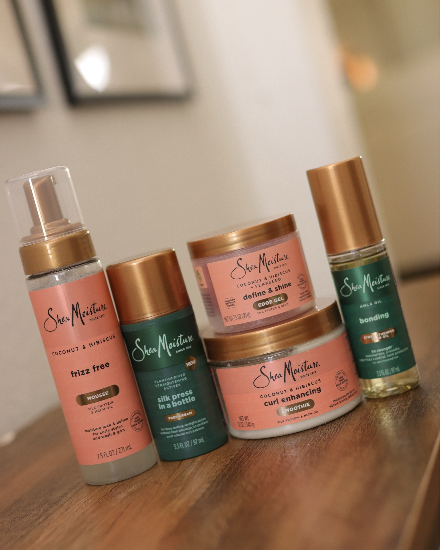 Shea Moisture killed it with this Silk Press in a bottle and Bonding Oil - I used these two to blow dry and flat iron my hair and it came out so good!