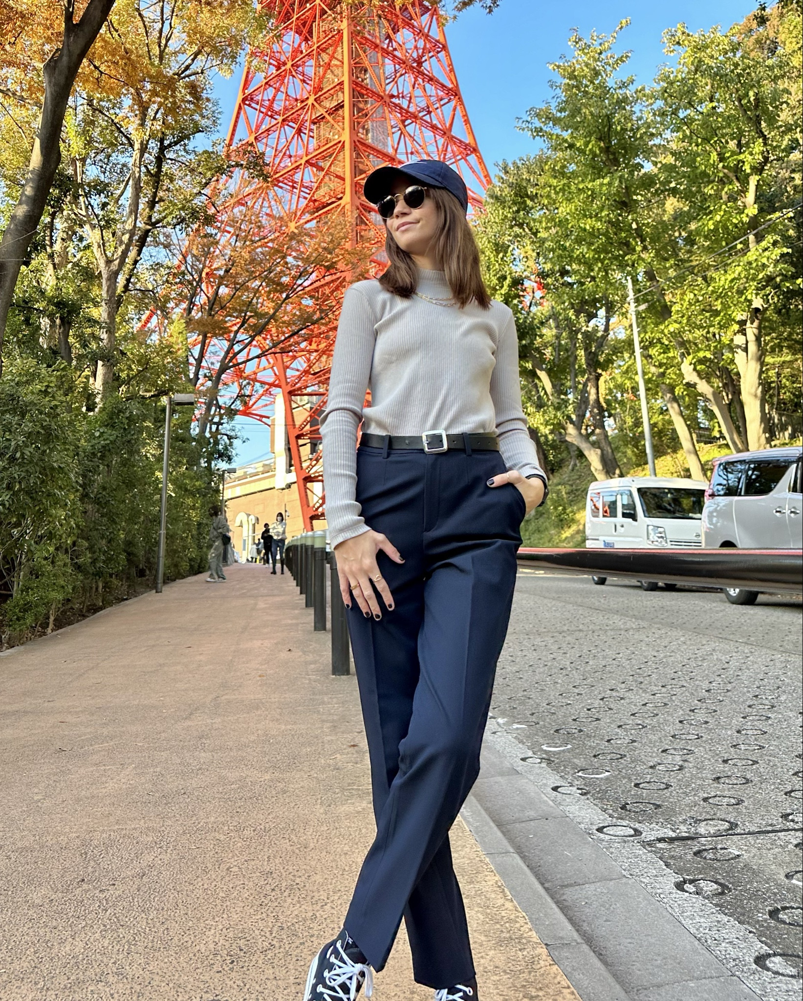 Navy blue slacks + beige turtle neck + navy blue nike hat 

#LTKBeauty