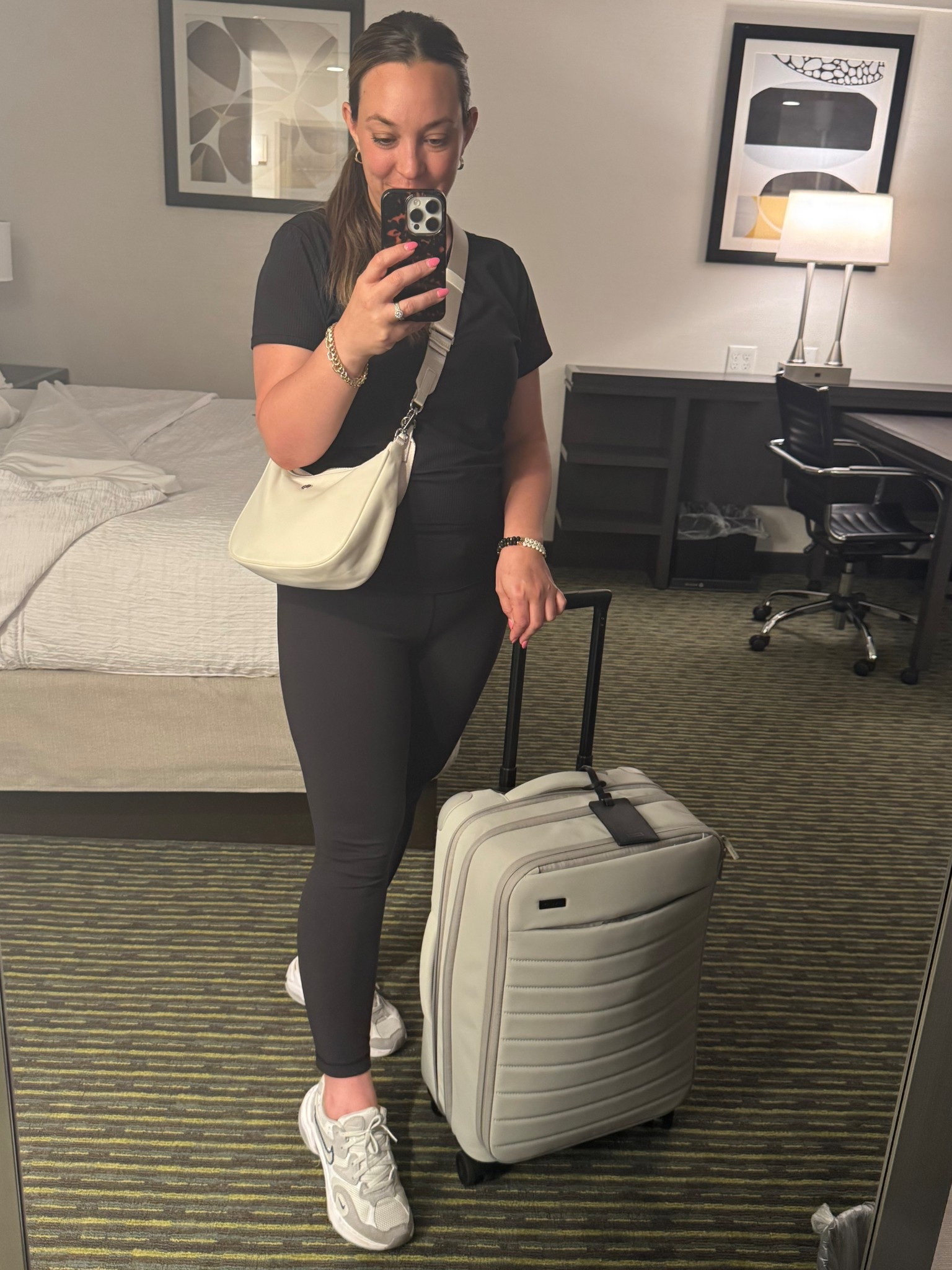 Travel outfit suitcase carryon white crossbody casual outfit 

Loved this comfy and cute travel outfit! Wearing size 12 in the top and 10 in the leggings! 😘
Also super impressed by the amount of stuff I could fit into this carryon suitcase! ✈️

#LTKTravel #LTKStyleTip #LTKOver40