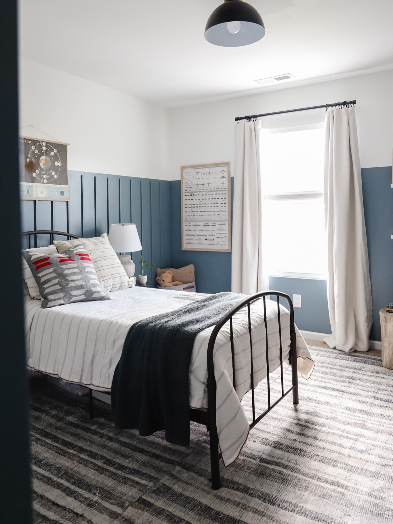 Boy’s room, black twin bed, striped blue and green rug, super soft rug, CLJxloloi rug, ivory black out curtains, military vehicle art, space themed art

#LTKkids #LTKhome #LTKfamily