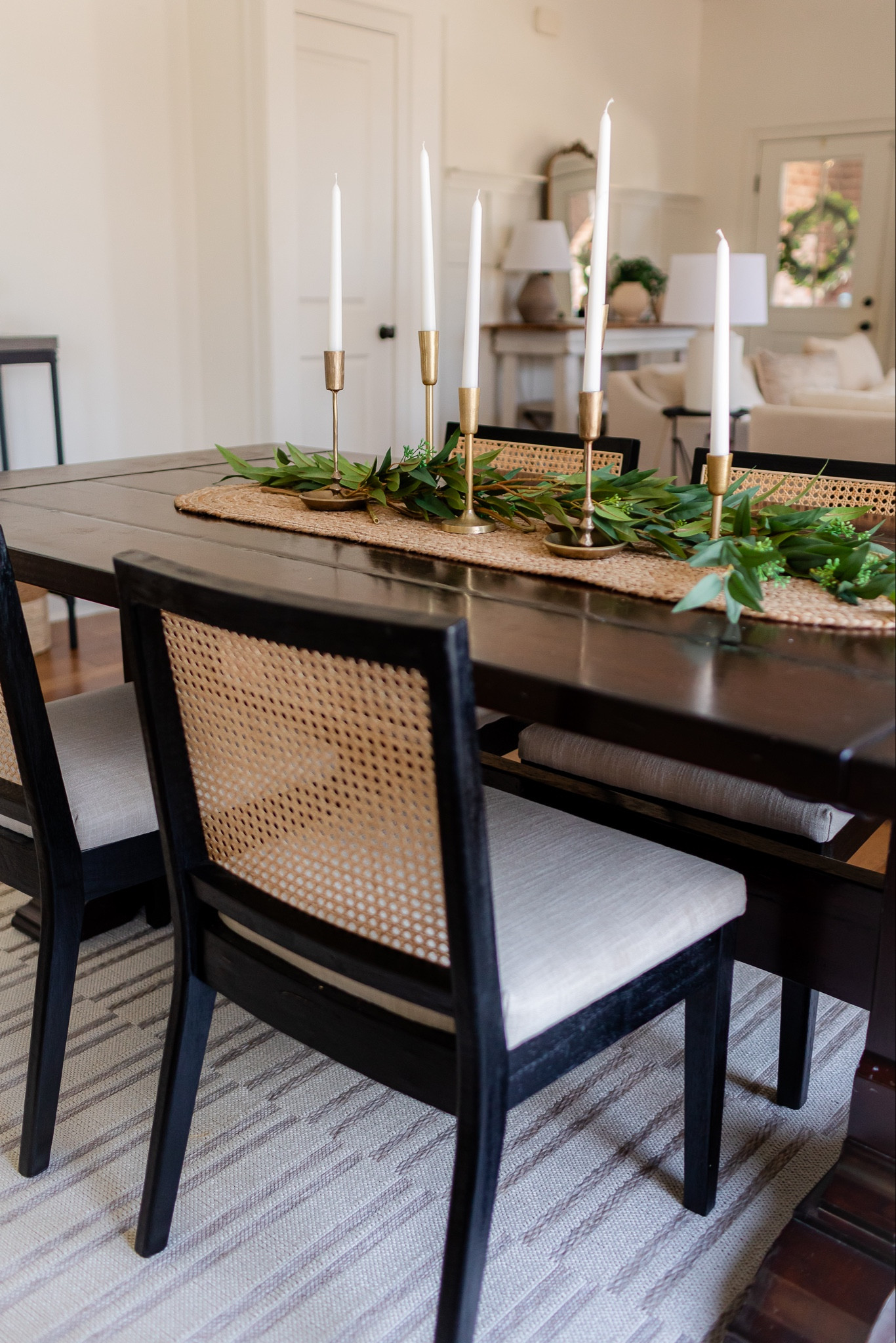Spring dining room views // a very simple spring centerpiece idea is using a jute table runner + spring stems or garland + gold candle holders and tapers! 

#LTKfindsunder50 #LTKSeasonal #LTKhome