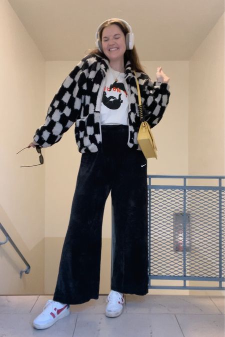Harry styles love on tour graphic tee, Nike velour sweatpants, free people movement black and white check jacket / coat, fleece / Sherpa, gola sneakers, Jacquemus yellow bag, urban outfitters sunglasses, Amazon headphones, casual outfit, comfy clothes, budget friendly, affordable

#LTKstyletip #LTKunder50 #LTKunder100