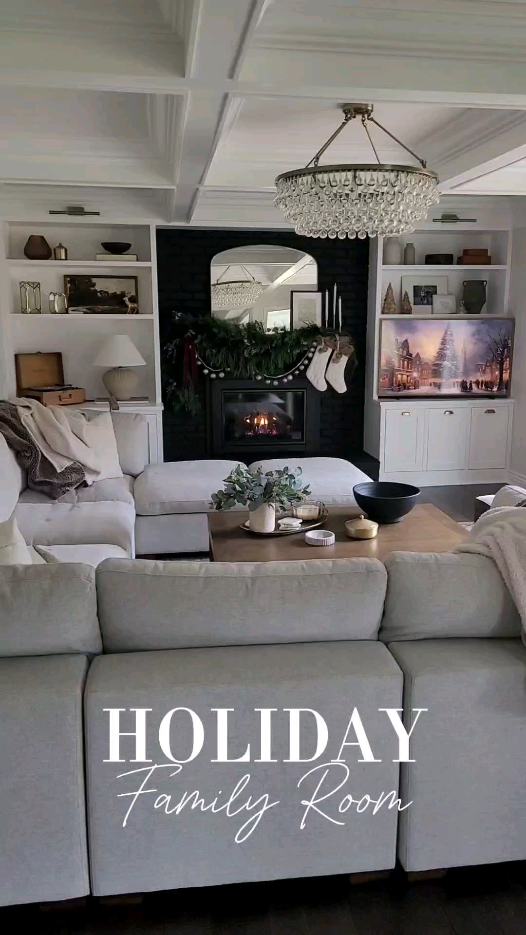 Cozy neutral holiday family room - I love layering throw blankets,  garland,  and neutral decor with vintage inspired peices like rugs and frame tv art to create a polished but cozy feel in our home!

#LTKWatchNow #LTKHoliday #LTKHome