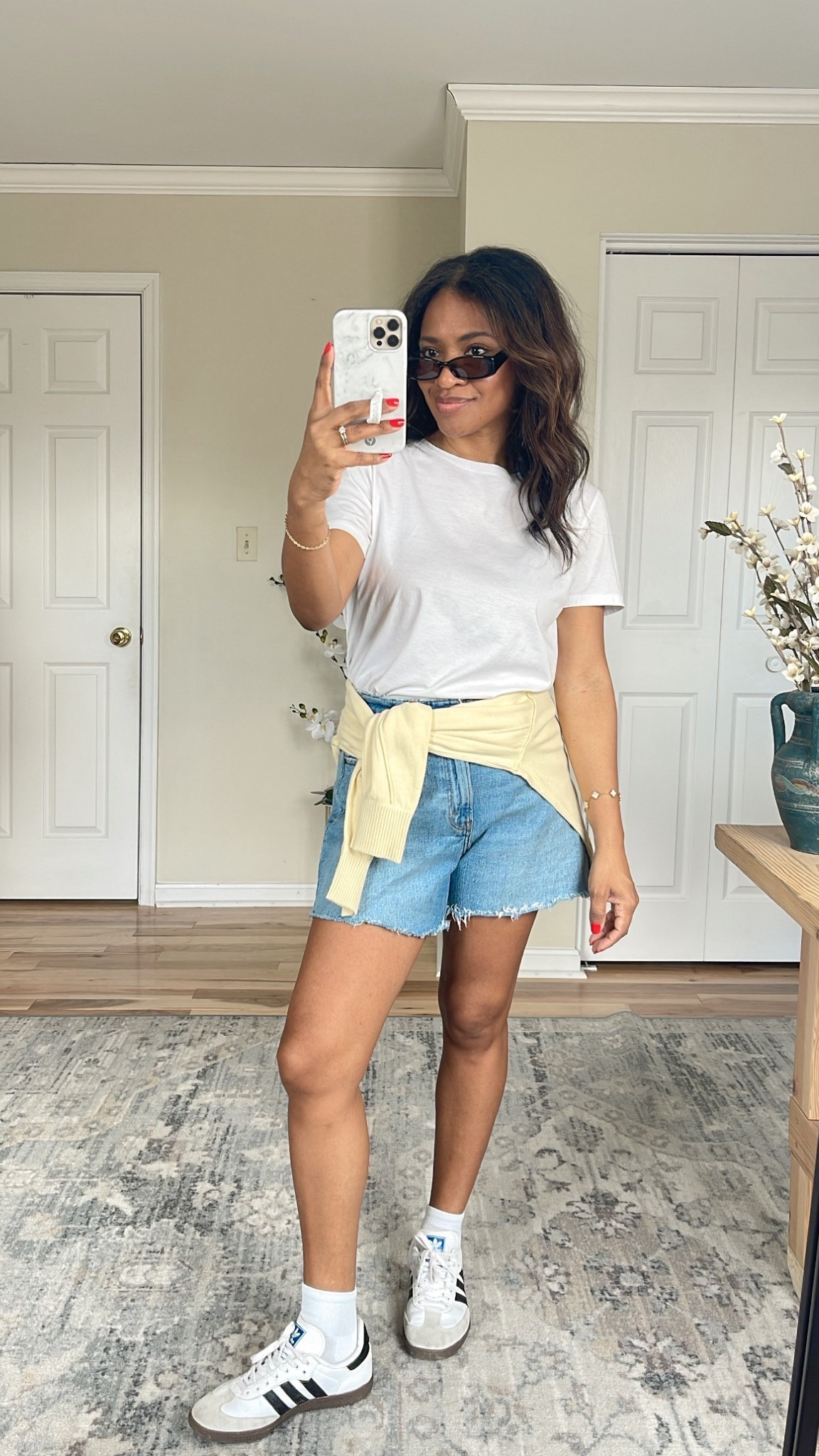 I’m wearing a small in the Zara shirt (linking similar) and a small in the yellow sweater. The yellow top is more of a lightweight sweatshirt material and the material is very soft. I really recommend it. My shorts are a size 27 and the curve love range. I recommend sizing 1/2 down in the Adidas sneakers. ￼