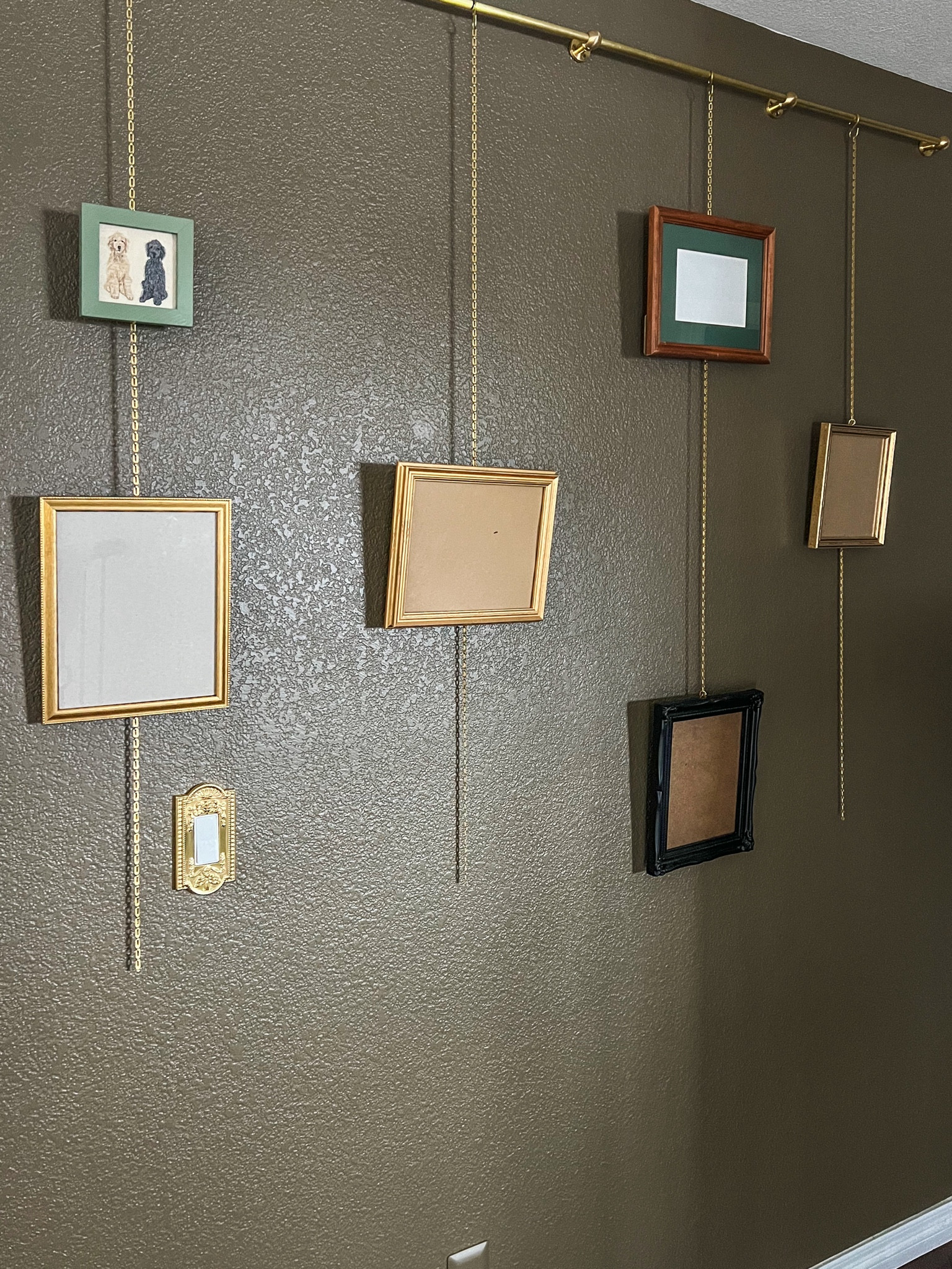 Brass gallery picture wall system.

#LTKstyletip #LTKhome #LTKfindsunder100