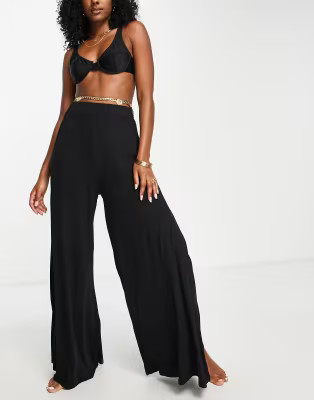 ASOS DESIGN jersey palazzo beach pants in black | ASOS (Global)