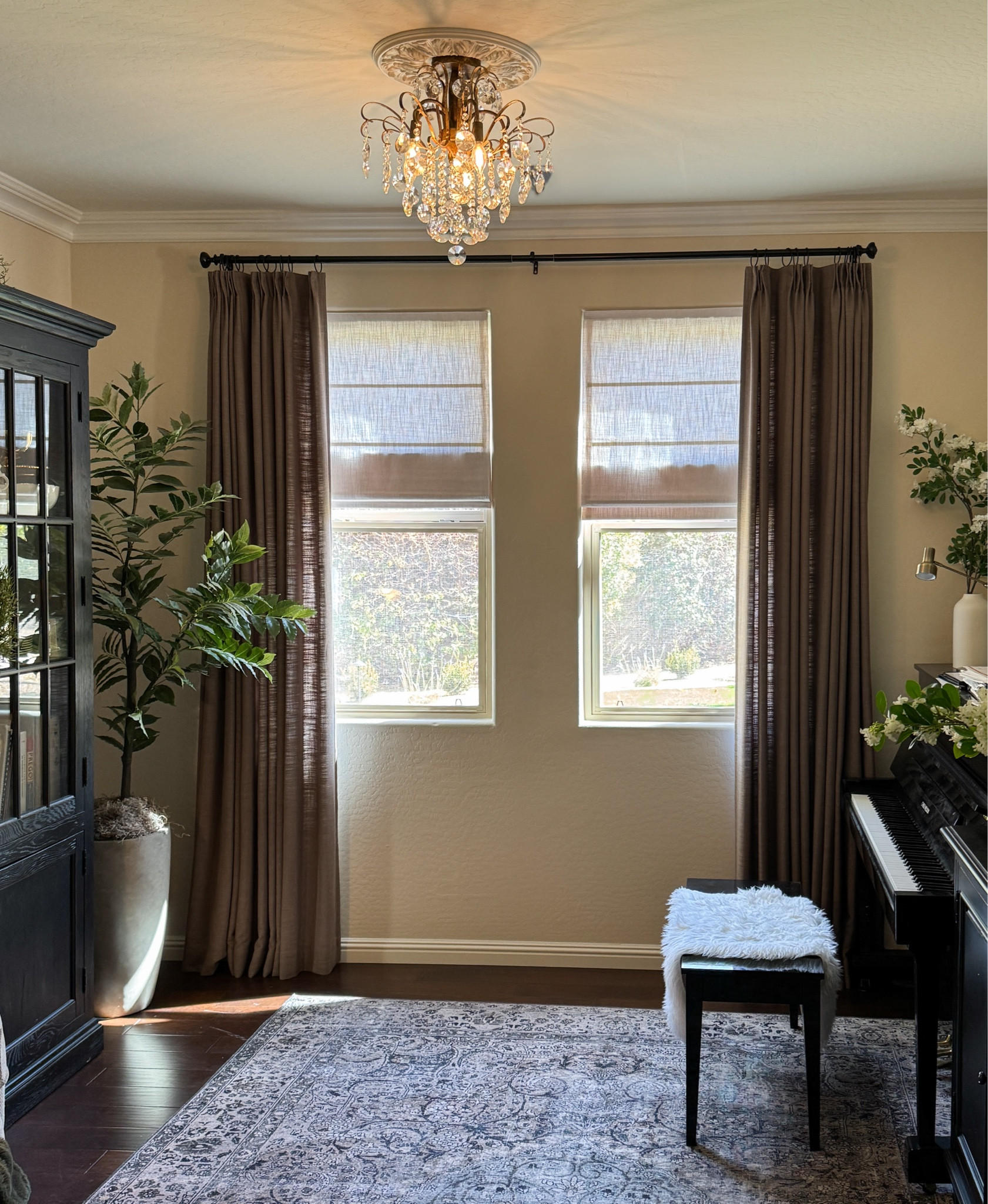 Custom curtains & custom Roman shades from Two Pages Curtains in our music room. 

Liz Linen Drape Pinch Pleat in Oak Dim Gray and Liz Linen Roman Shades in Beige White 
Discount Code: JOYFUL

I used European Gold Rub n Buff on my chandelier 

Crystal chandelier flush mount

#LTKHome