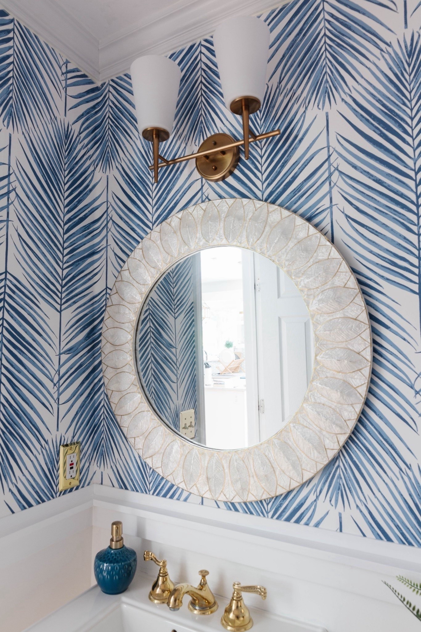 This coastal powder room with blue and white palm print wallpaper is one of my favorite small-space design moments. I love how the bold wallpaper paired with crisp white accents makes the room feel elevated, layered, and designer-inspired. 


#LTKHome #LTKSaleAlert #LTKU