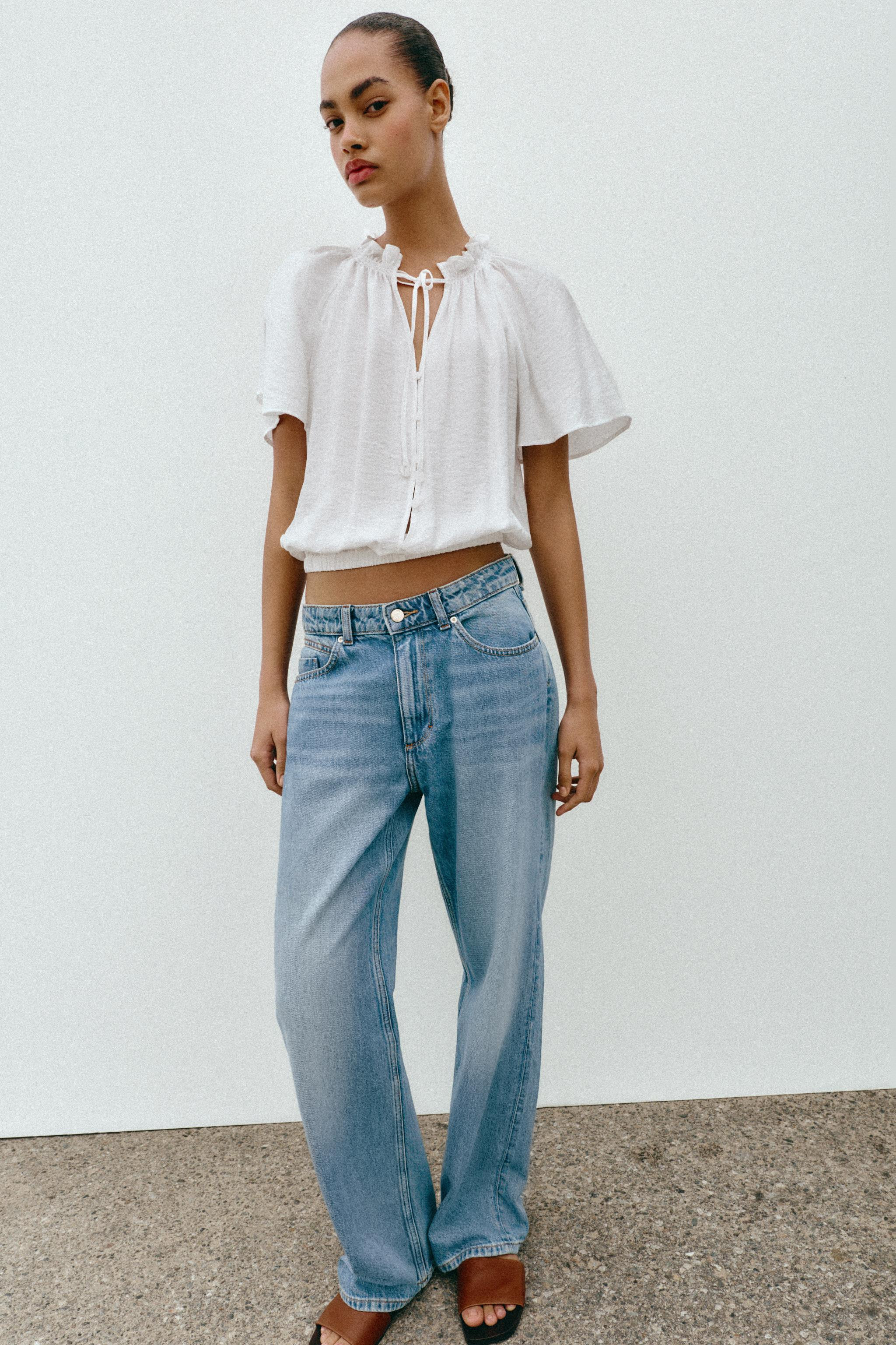 DescriptionColorContentsMeasurementsBlouse with ruffled neck and tie detail. Wide short sleeves. ... | Zara US
