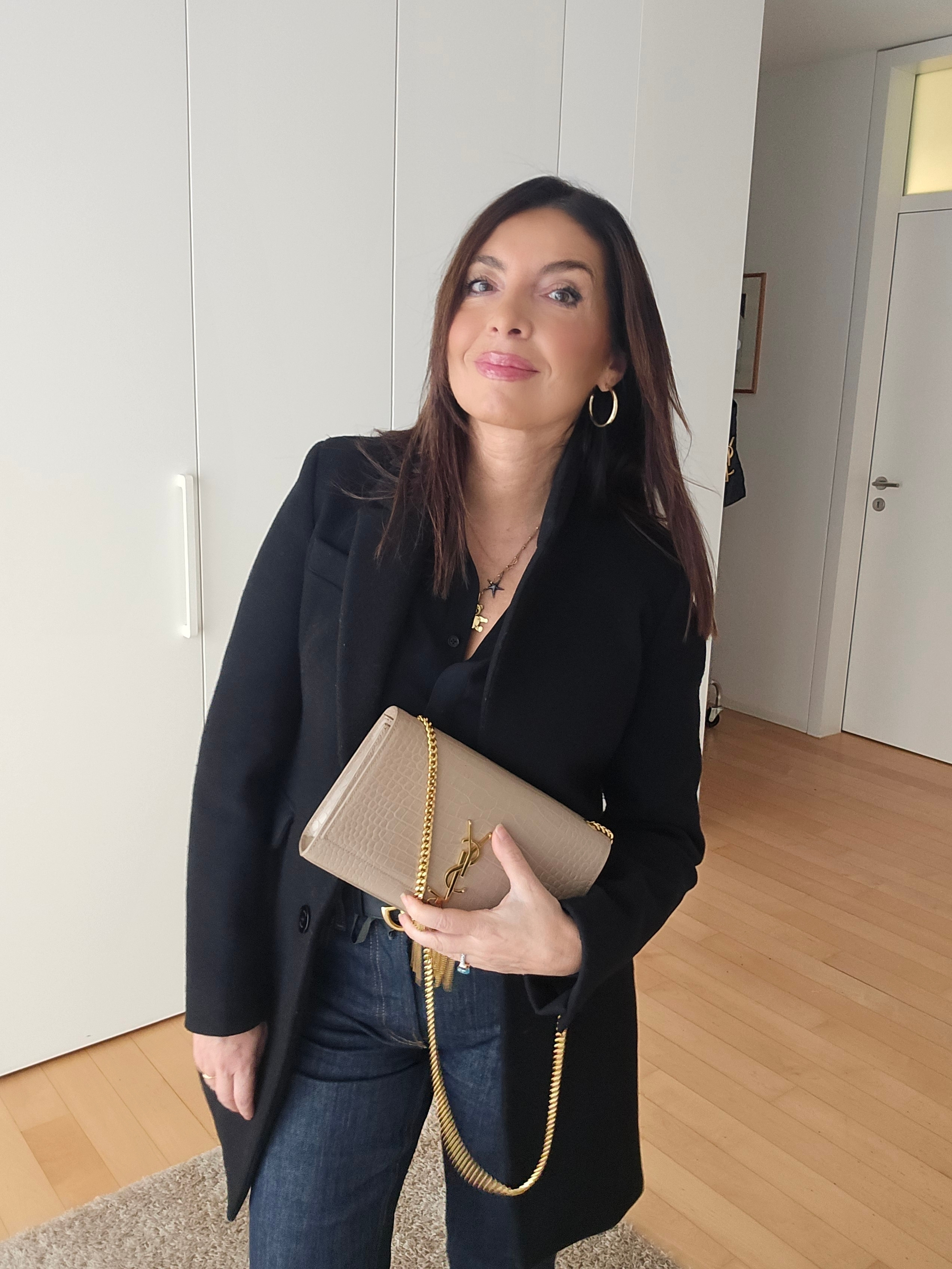 A classic black coat with dark blue jeans for a chic yet casual vibe, and elevate the look with sleek black booties. Finish it off with the iconic YSL Kate bag for that touch of luxury. Perfect for city strolls or a polished everyday outfit. #WinterOutfitGoals #EffortlessChic #LuxuryStyle  

 #LTKitalia #LTKeurope #LTKwinter