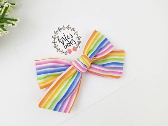 Bright rainbow stripe hand tied hair bow, alligator clip, nylon headband, rainbow bow, hair bows,... | Etsy (US)