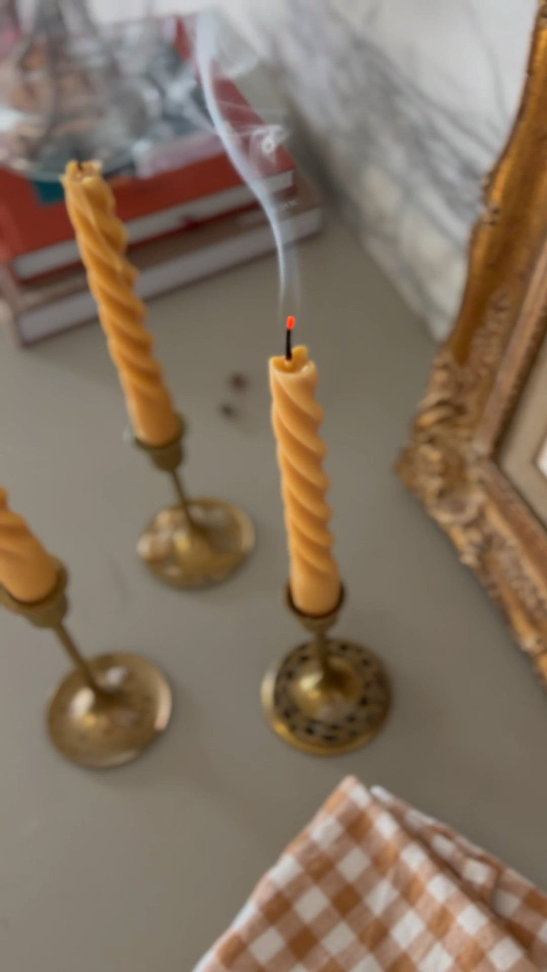 Well I’m here to redeem myself after the unintentional, incredibly phallic spiral candles earlier this year. 🫣 I’m using a slightly different mold and pure, dye-free beeswax this time because it holds its shape better than soy wax, is cleaner burning than paraffin, and doesn’t have the fleshy coloring of the last batch of candles. 😬

We use tons of candles throughout winter months. They bring so much cozy, so I like to make a batch and use them throughout the year. Here’s how I made them:

Supplies: (See my ‘LikeToKnowIt’ for direct links)
• Silicone Spiral Taper Candle Mold 
• Cotton Wick
• Brown Packing Tape to home the mold closed 
• Bobby Pin
• 1 Cup Pure Beeswax chips for two candles
• Parchment or Wax Paper. I prefer parchment because it’s compostable.
• Old Saucepan
This silicone mold does NOT require a release spray. Woo!

1. Cut wick a few inches longer than the length of the mold. Then thread the wick lengthwise into the mold.
2. Tape the mold securely closed around the sides.
3. Melt beeswax chips on stove with the lowest heat setting. Stir constantly until just melted.
4. Cover your work surface with parchment or wax paper. Stand the mold opening on end up and pour wax into mold. 
5. Use a Bobby pin to center the wick in the opening.
6. Let dry for 12-24 hours. Then carefully remove candle from mold & trim wick ends.

Unless you have two of the same molds, you’ll make one candle at a time. However, I melt enough wax for two candles at once. After you pour the first candle, the leftover wax will harden in the pan. Just re-heat over the double boiler when you’re ready to pour the next candle. 
#handmademodernhome

#LTKHome #LTKVideo #LTKSeasonal