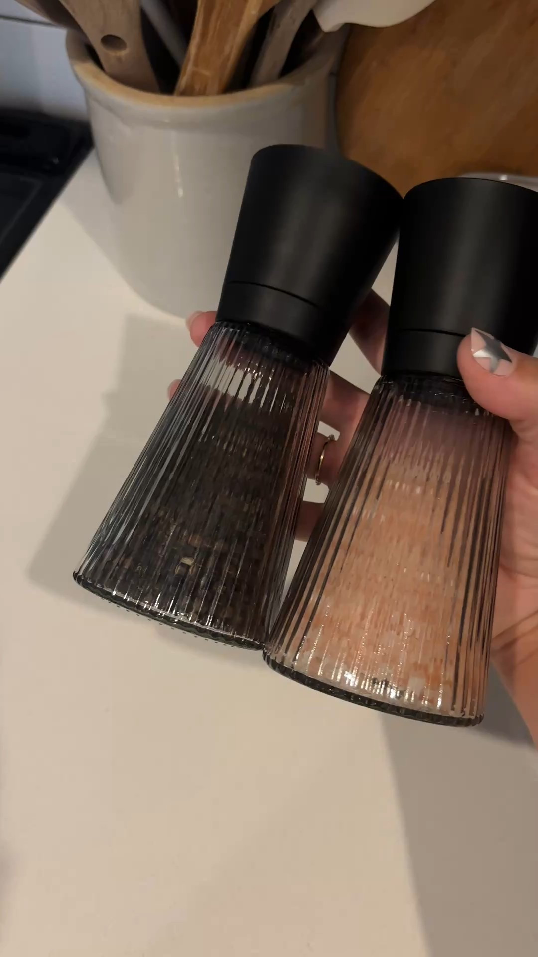 I’ve been searching for the best salt and pepper grinders that double as décor, and this one is a standout. The smoke-colored glass features fifty minimalist grooves that catch the light and offer a good grip, while the durable black plastic and patinated steel top keeps spices fresh. I love that the grinder mechanism is placed at the top so there’s no messy residue on the table—form and function balanced perfectly. If you want an aesthetic salt and pepper set that elevates your kitchen without the designer price tag, this is the one.

#LTKSaleAlert #LTKHome