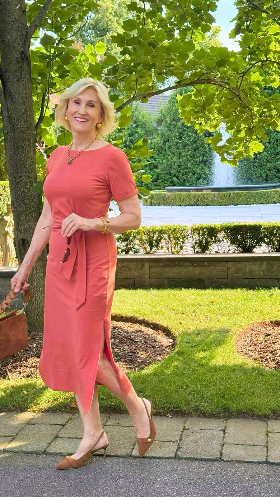 I love pairing coral and camel together as it just feels so effortlessly chic 🤎🧡 This Quince dress is such an easy one-and-done look — I love the short sleeves, flattering tie waist and that gorgeous pop of color.

I paired it with camel suede slingbacks and a matching suede bag for a little tonal moment. Simple, feminine and the kind of outfit that makes getting dressed feel easy. ✨

#LTKSeasonal #LTKOver40 #LTKootd