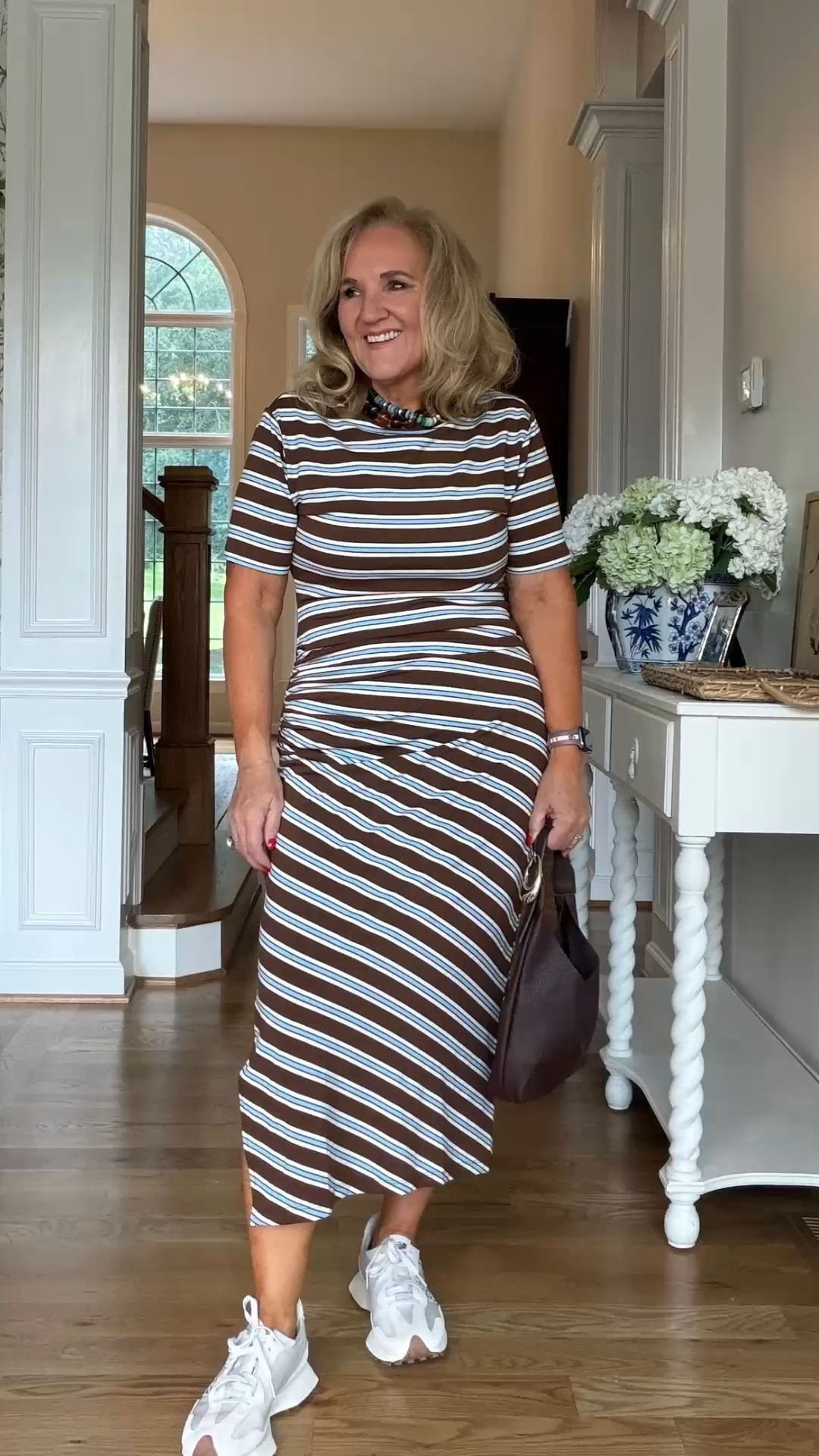 This striped midi dress is the perfect mix of flattering and comfortable. The soft brown-and-white stripes and easy silhouette make it a great choice for everyday wear, from lunch to running errands.

💡 LTK MADE EASY
❤️ Heart = Support my posts!
🔖 Save = Get sale & restock alerts
📋 Lists = Keep favorites organized
📲 Share = Send lists and products to a friend. Hello, Christmas List!
💬 Comment = Ask me anything about what I'm wearing.:-)

#LTKdayinmylife #LTKgrwm #LTKootd